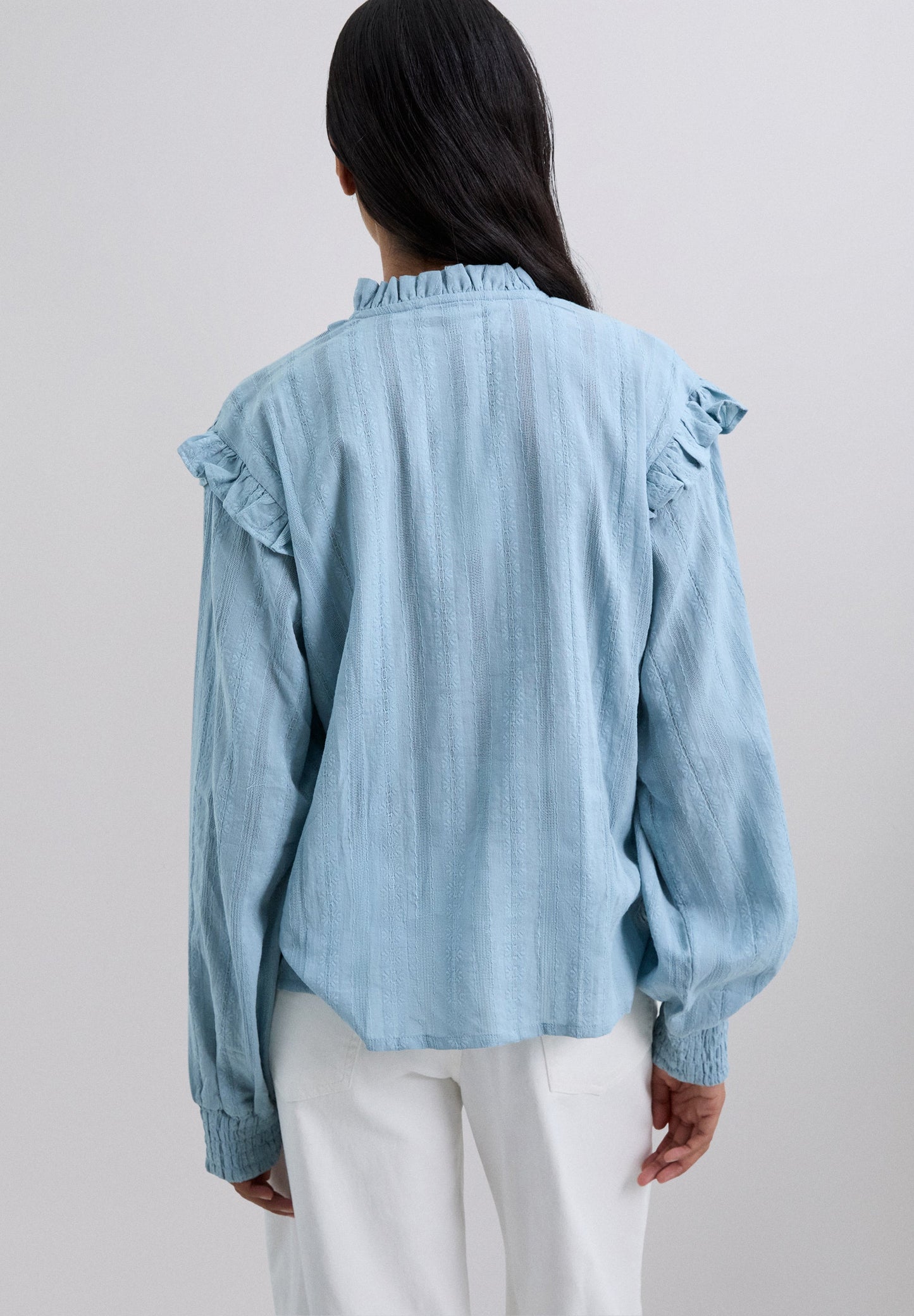 RUCHED BLOUSE WITH RUFFLES.