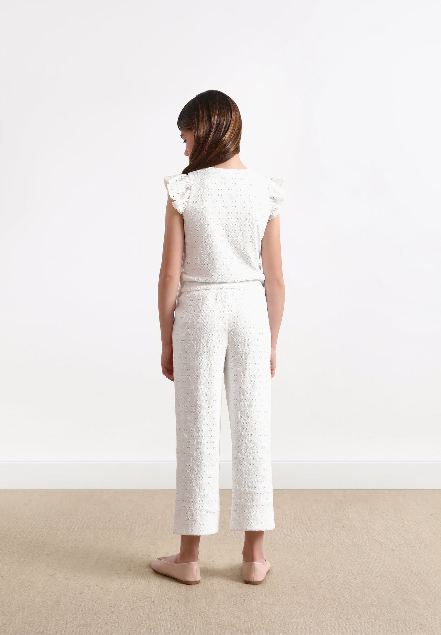 TROUSERS WITH OPENWORK DETAILS