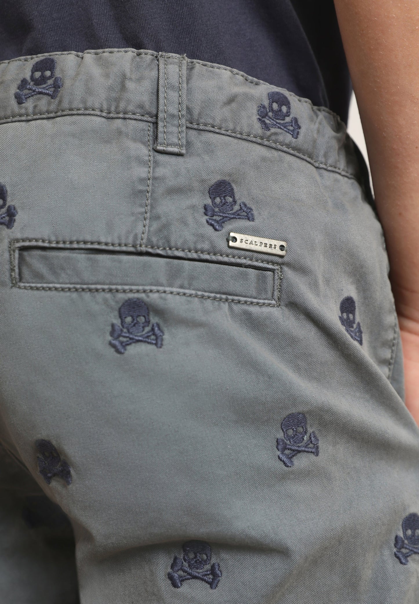 BERMUDA SHORTS WITH ALL-OVER SKULL PRINT