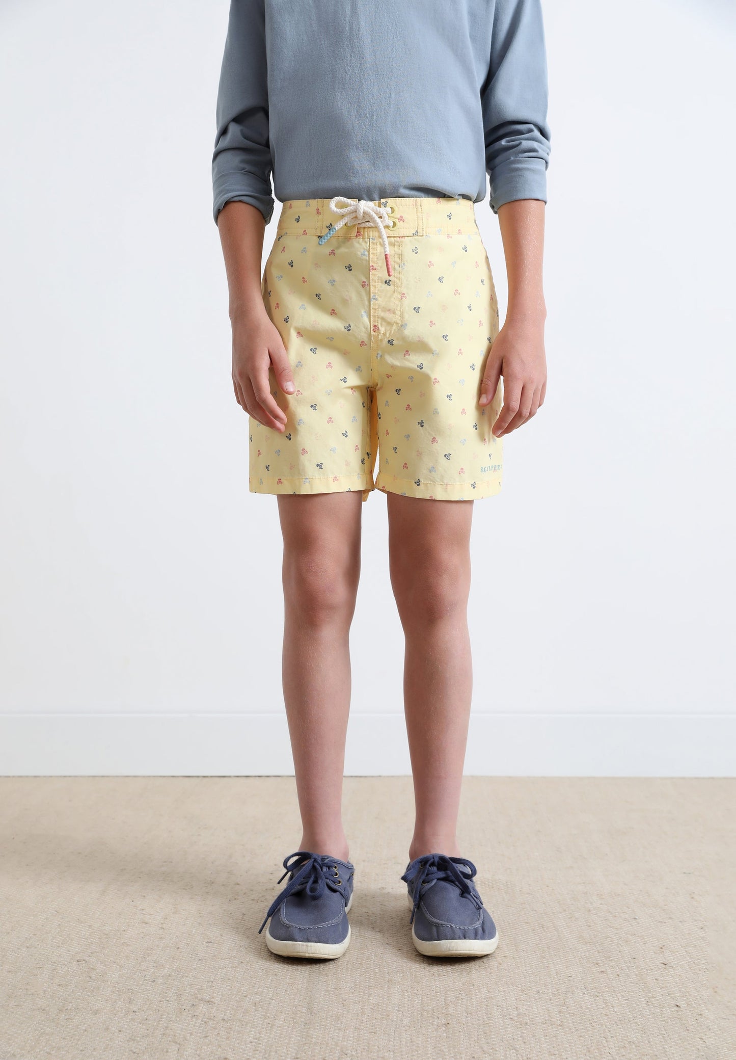 SWIMMING TRUNKS WITH ALL-OVER SKULLS