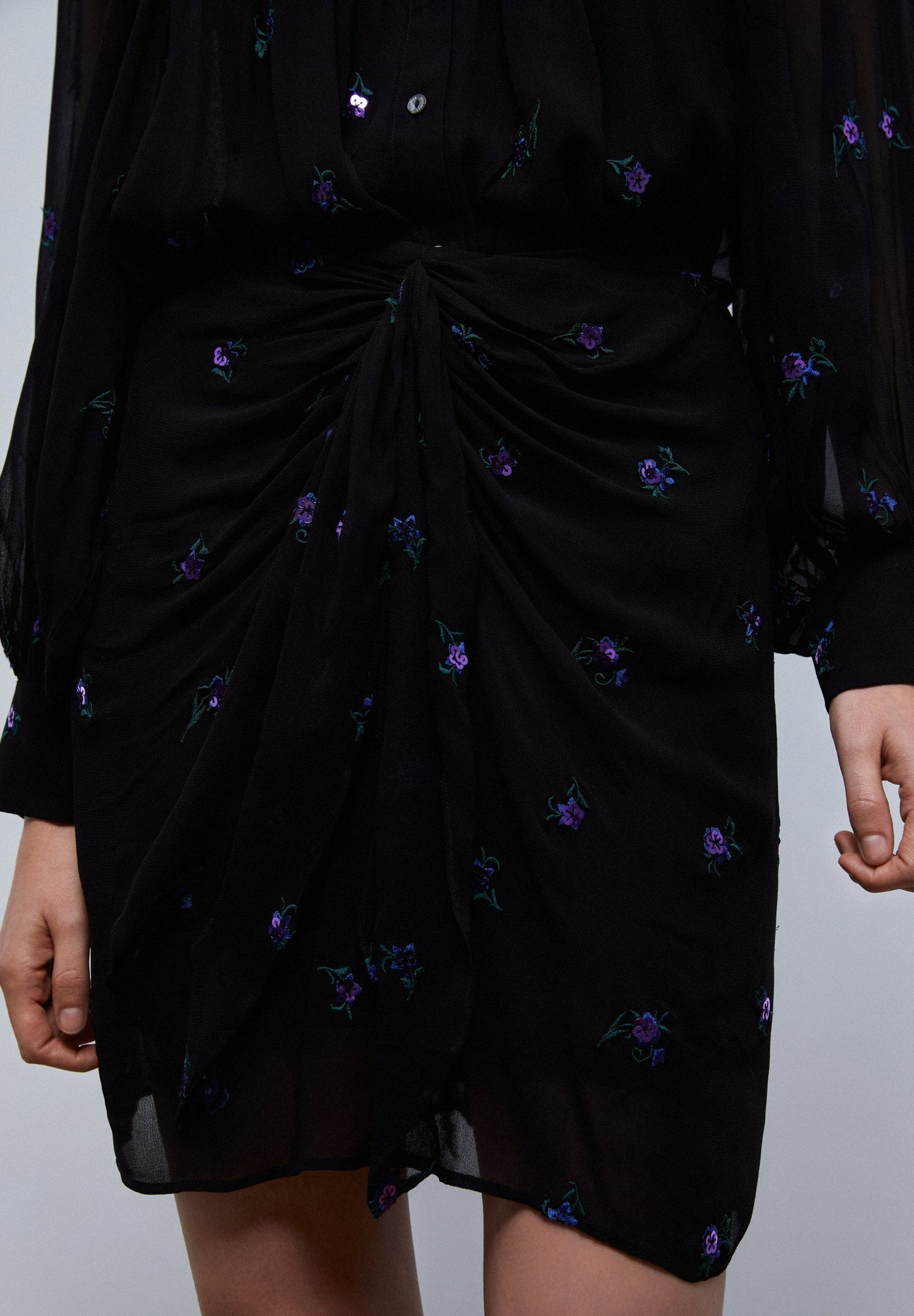 MINI SKIRT WITH KNOT AND FLORAL DETAIL