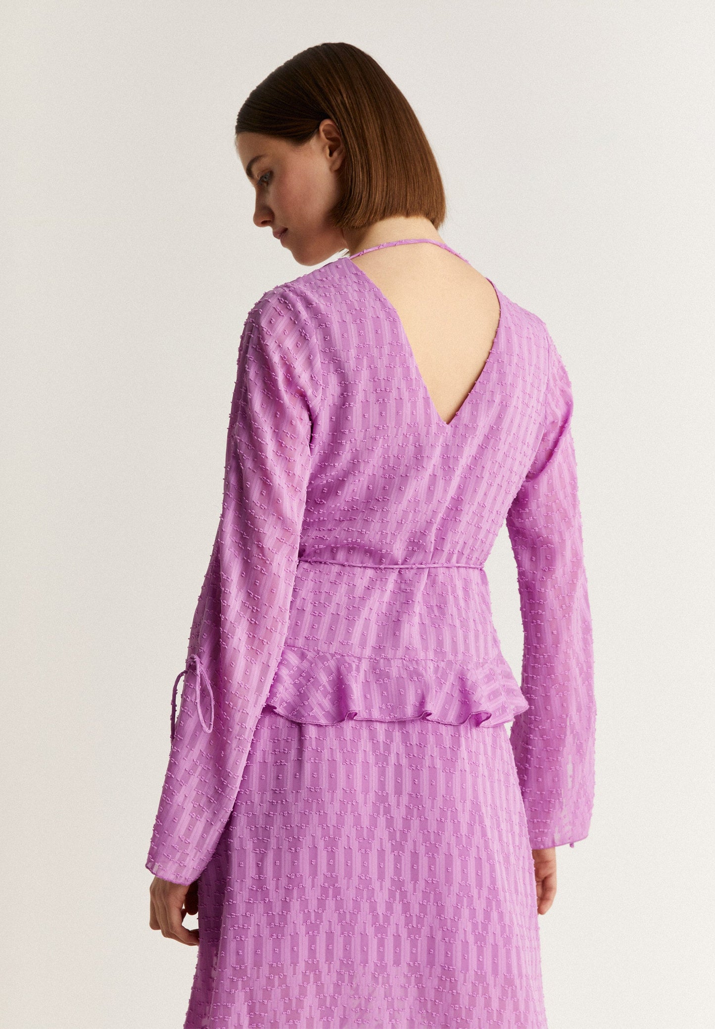 SWISS DOT BLOUSE WITH ASYMMETRIC HEM