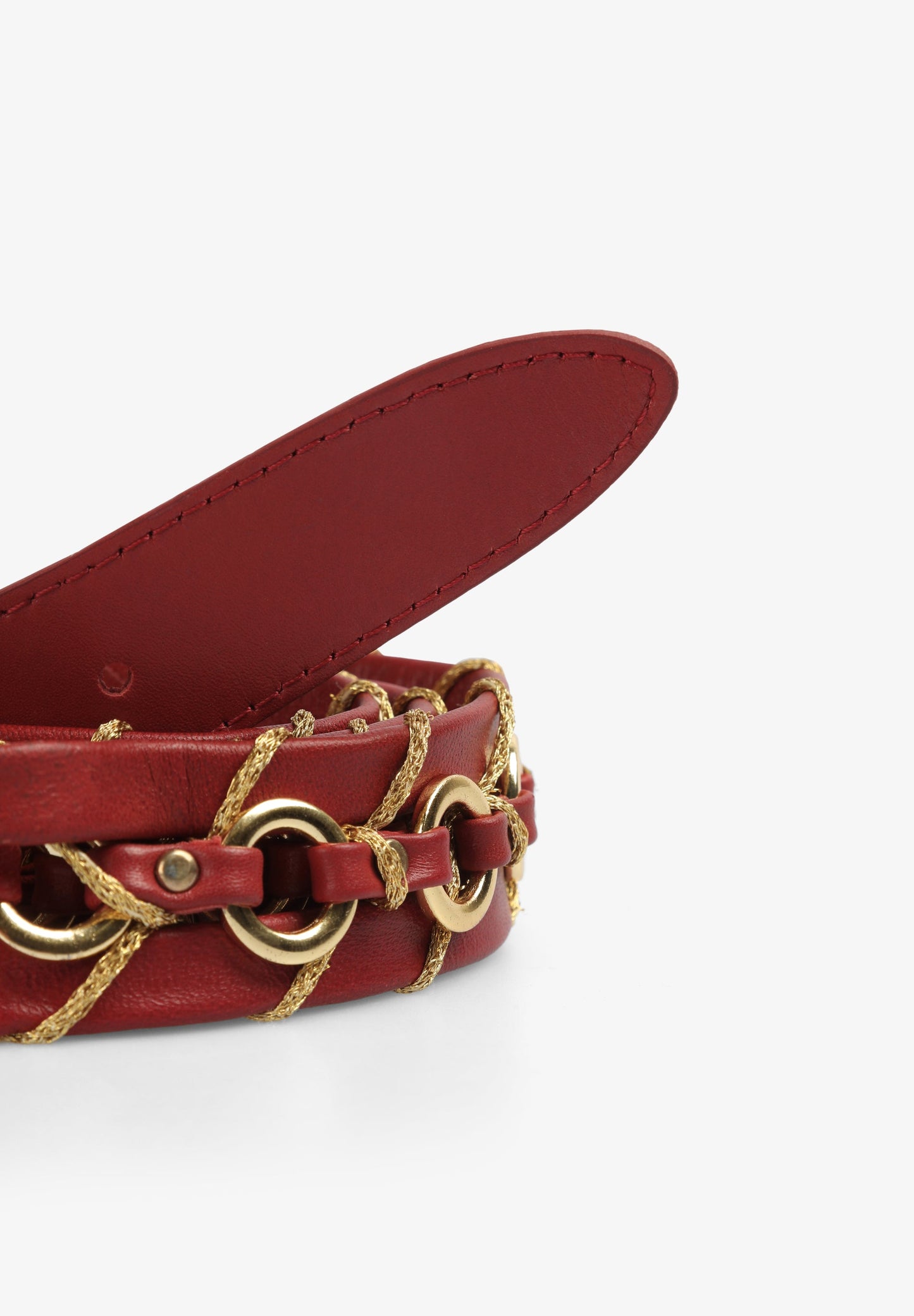 LEATHER BELT WITH EYELETS AND GOLDEN THREAD DETAIL