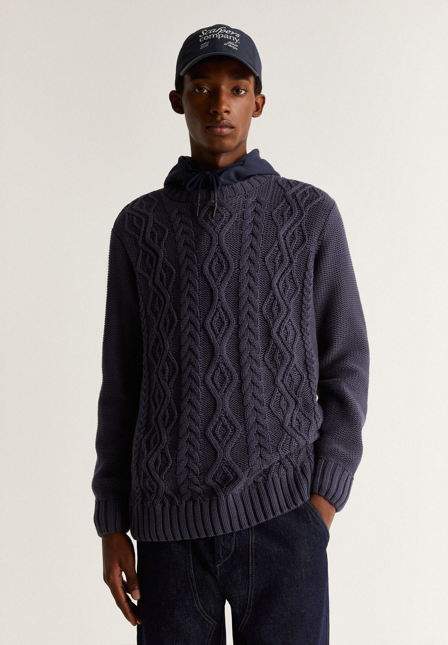 SWEATER WITH CABLE-KNIT DETAILS