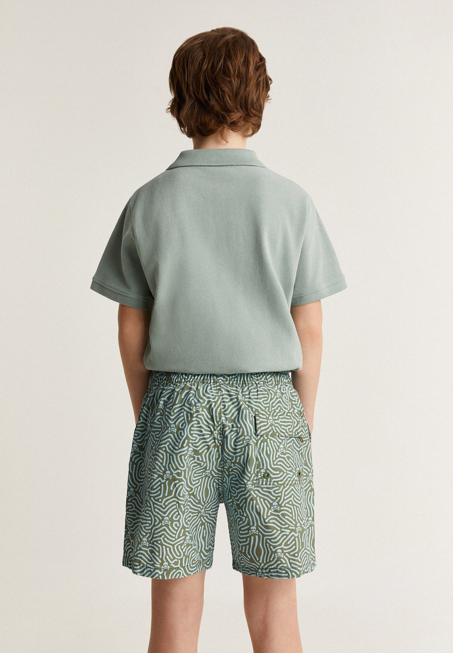 SWIMMING TRUNKS WITH ALL-OVER SKULLS DETAIL