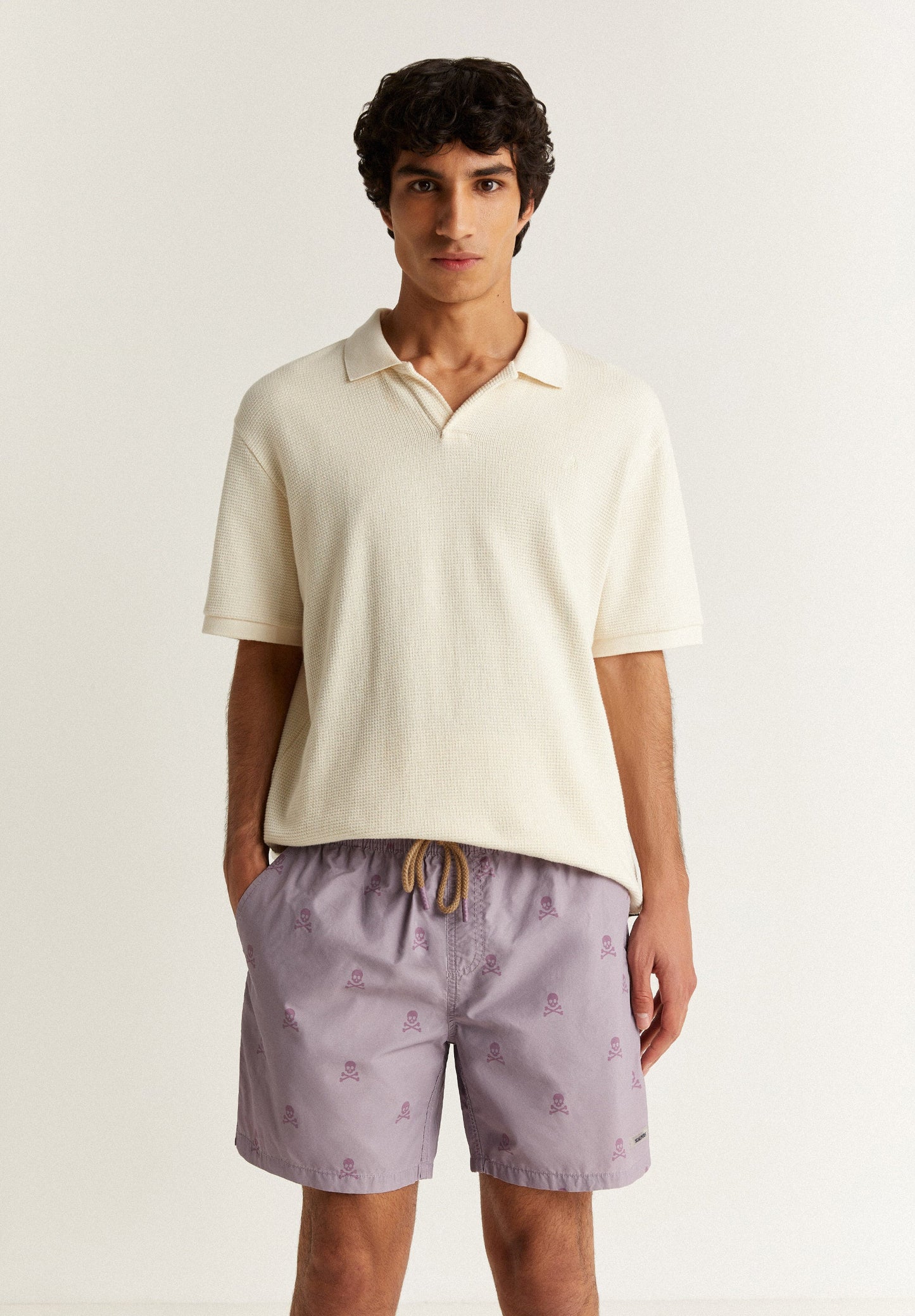 SWIMMING TRUNKS WITH ALL-OVER SKULLS