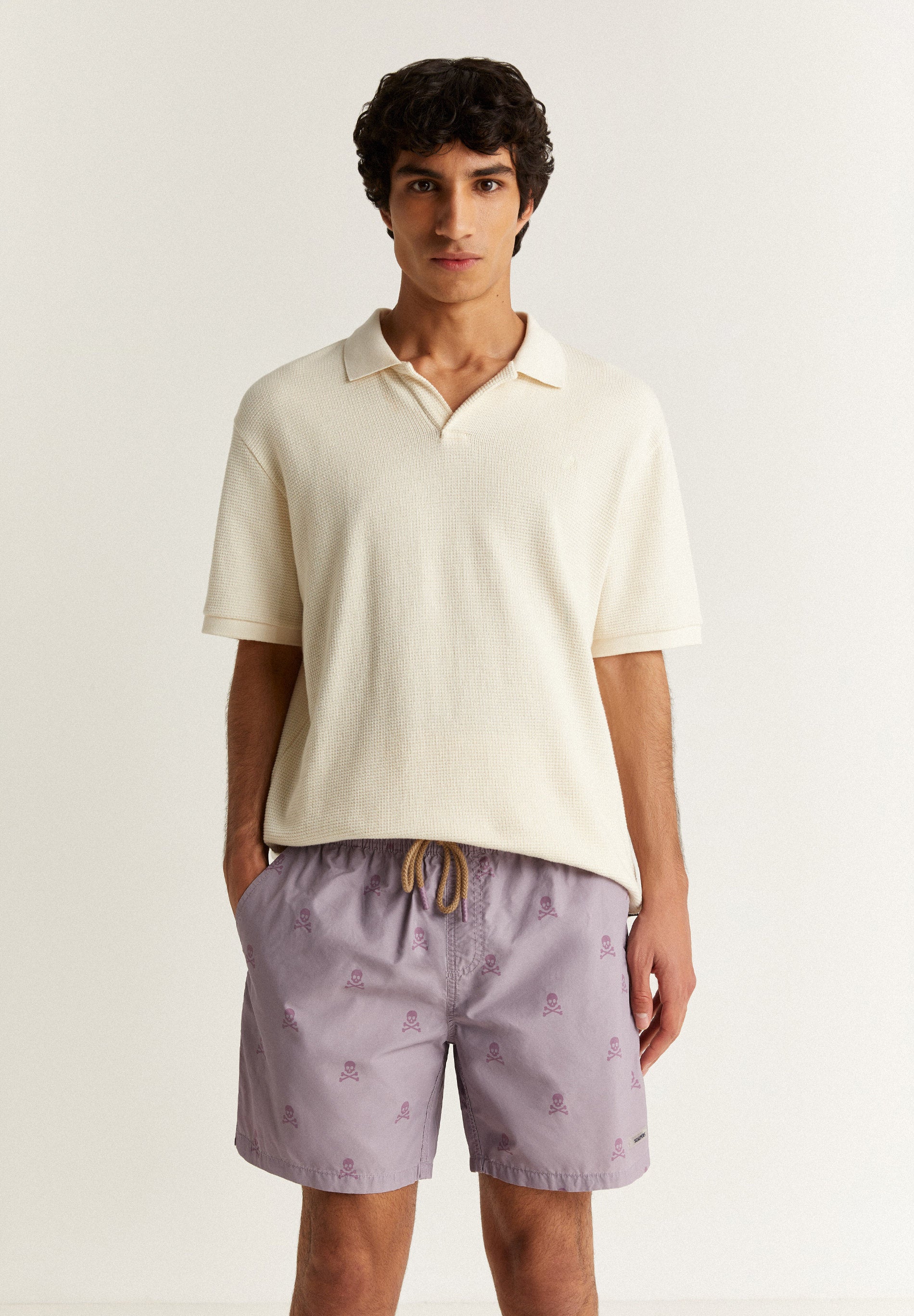 SWIMMING TRUNKS WITH ALL-OVER SKULLS