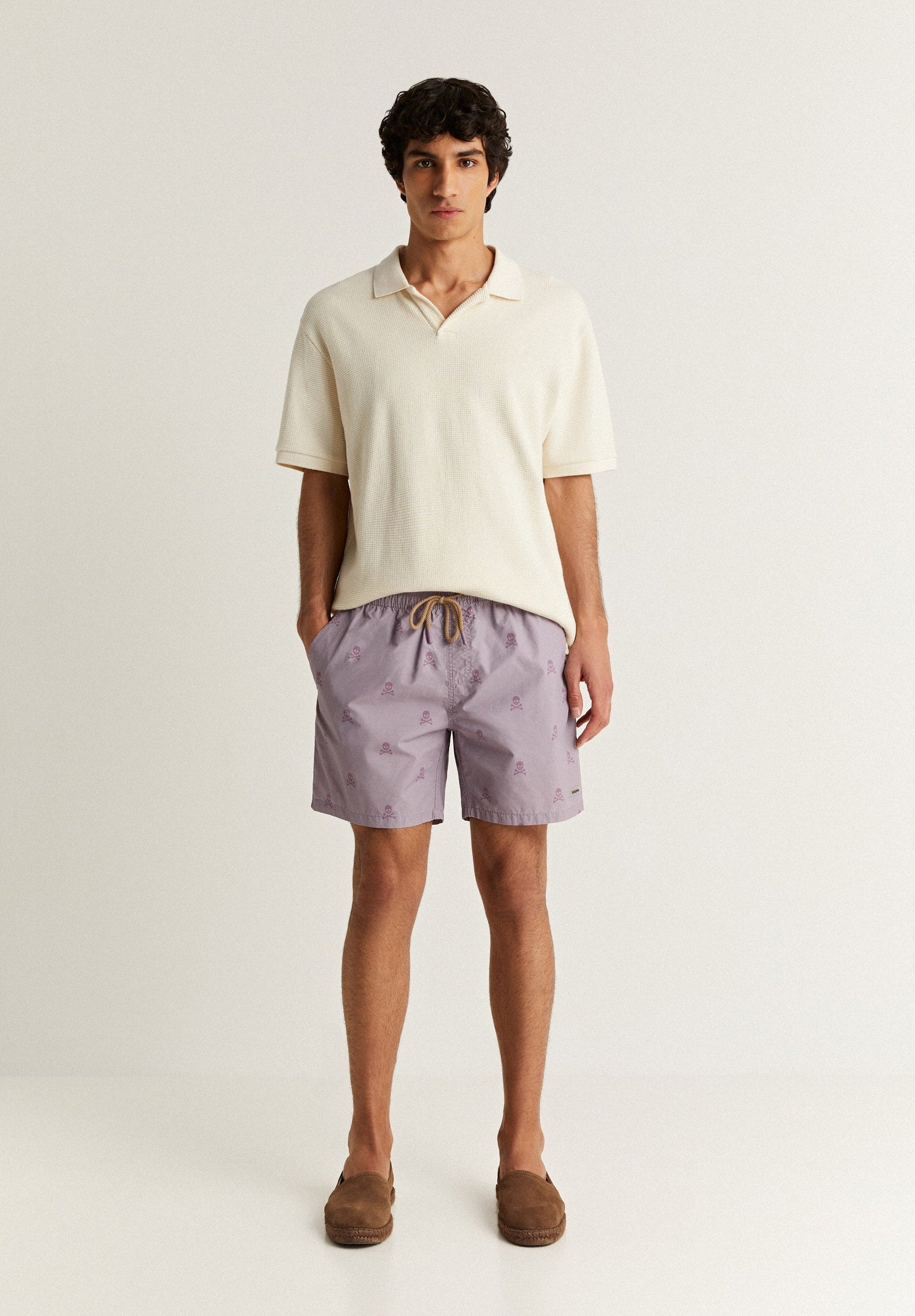 SWIMMING TRUNKS WITH ALL-OVER SKULLS