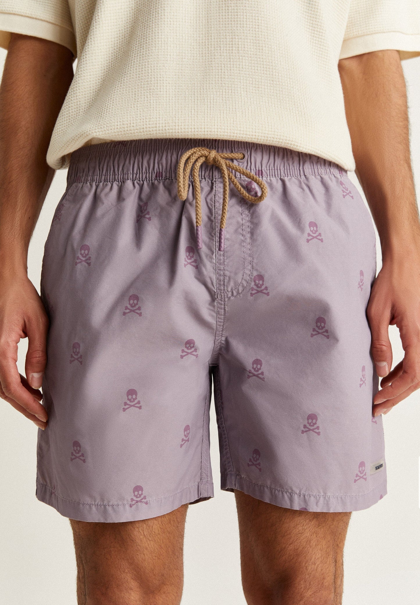 SWIMMING TRUNKS WITH ALL-OVER SKULLS