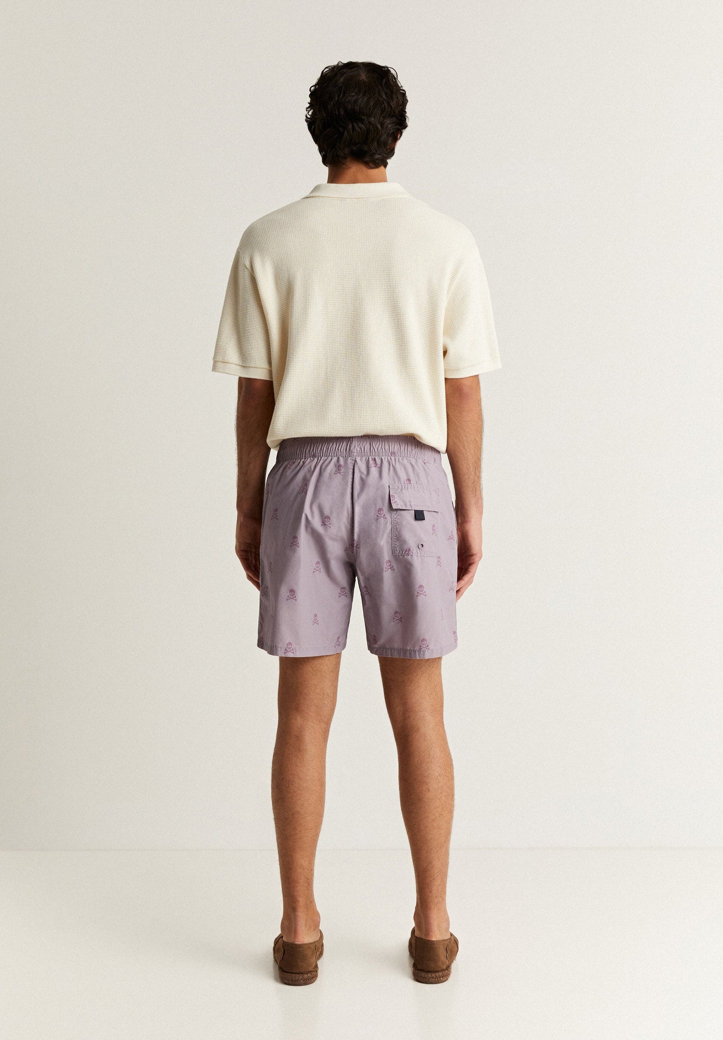 SWIMMING TRUNKS WITH ALL-OVER SKULLS