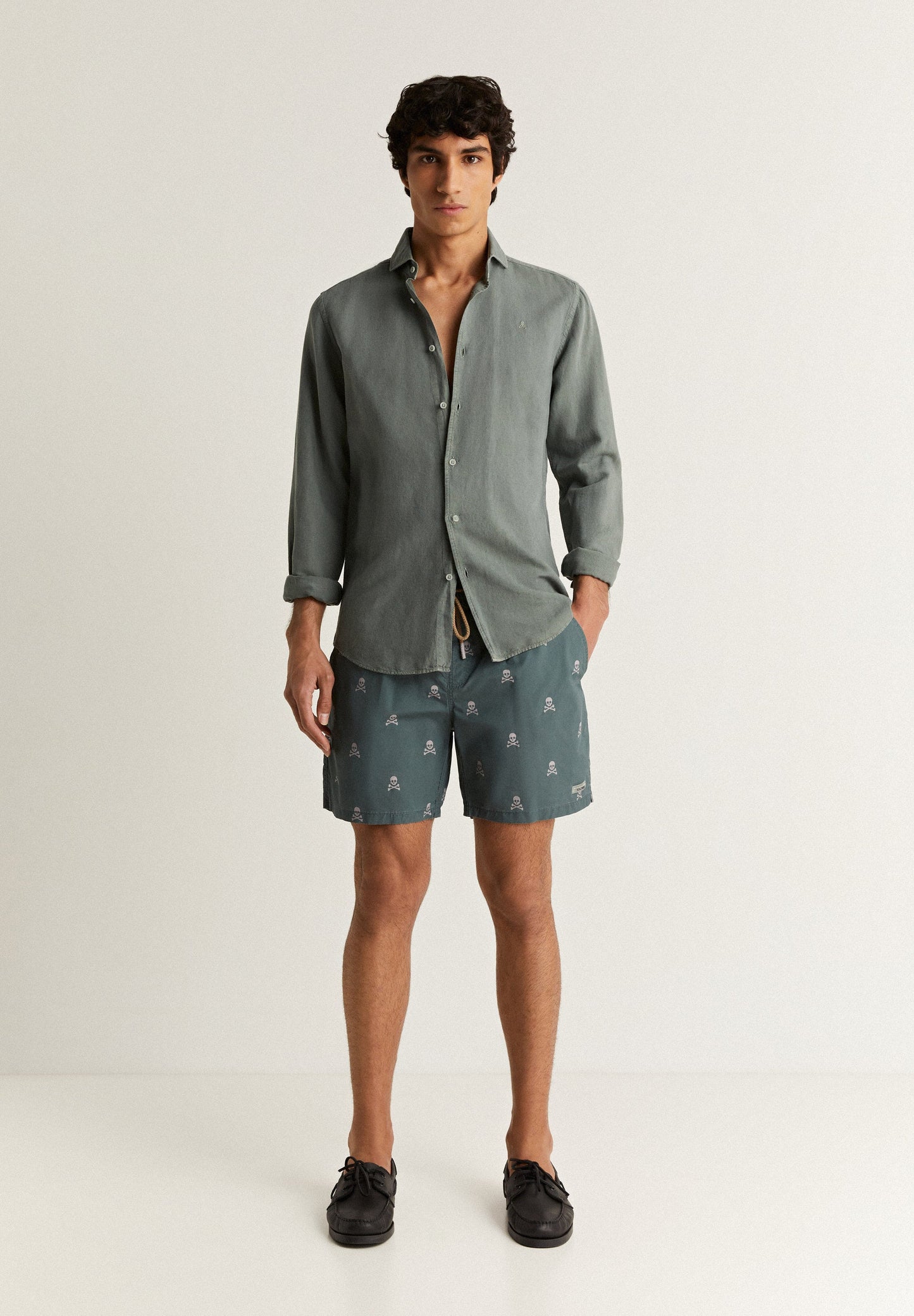 SWIMMING TRUNKS WITH ALL-OVER SKULLS