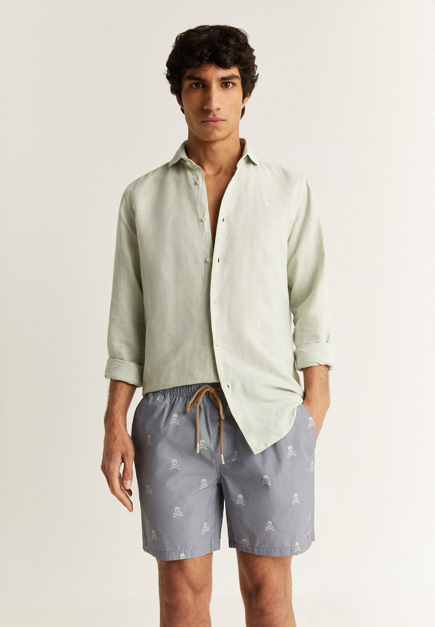 SWIMMING TRUNKS WITH ALL-OVER SKULLS