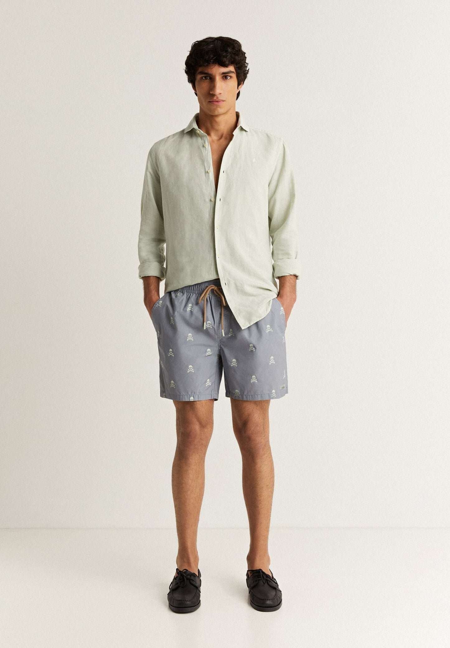 SWIMMING TRUNKS WITH ALL-OVER SKULLS