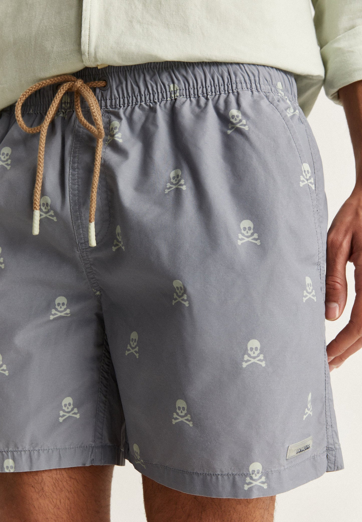 SWIMMING TRUNKS WITH ALL-OVER SKULLS