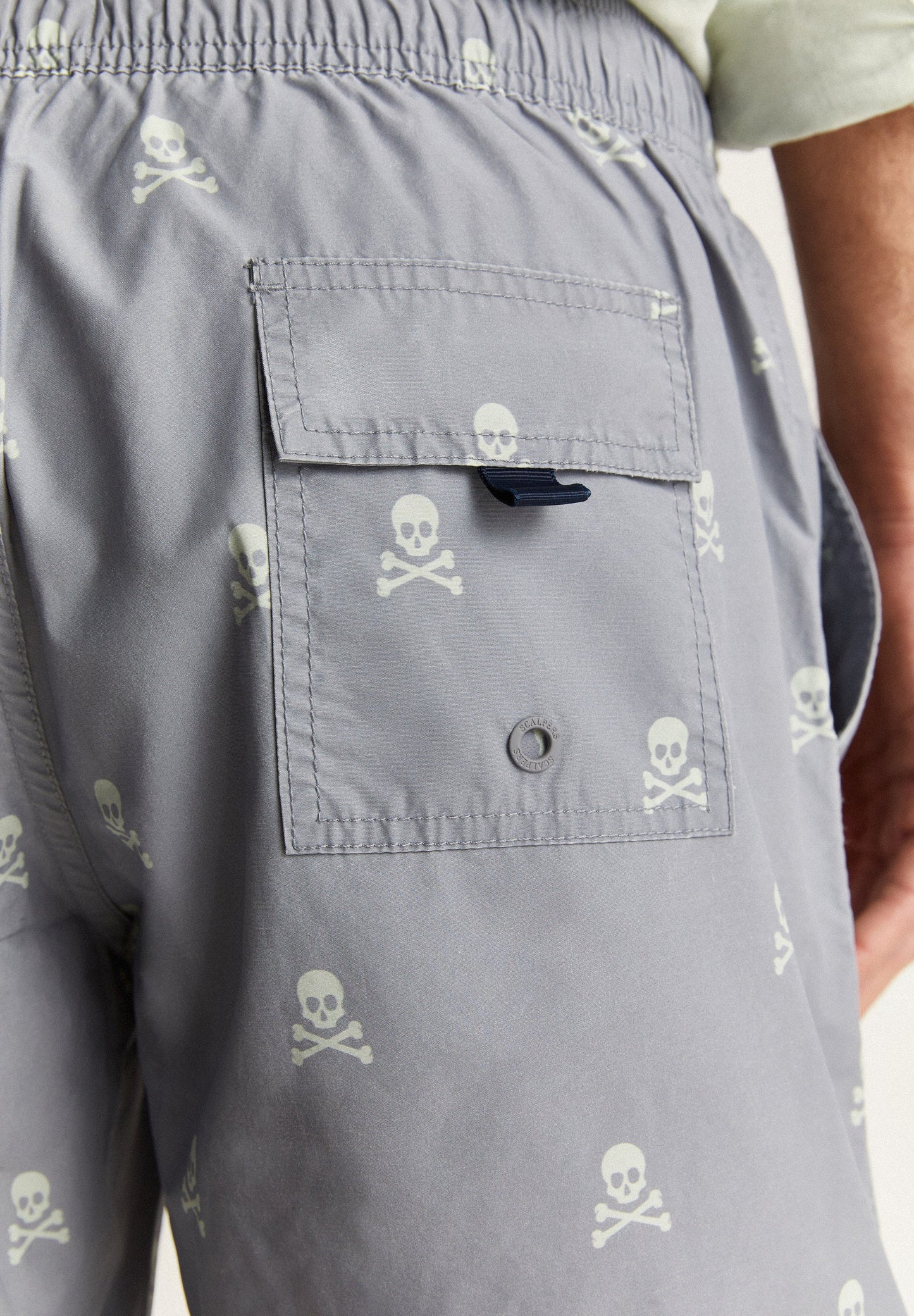 SWIMMING TRUNKS WITH ALL-OVER SKULLS