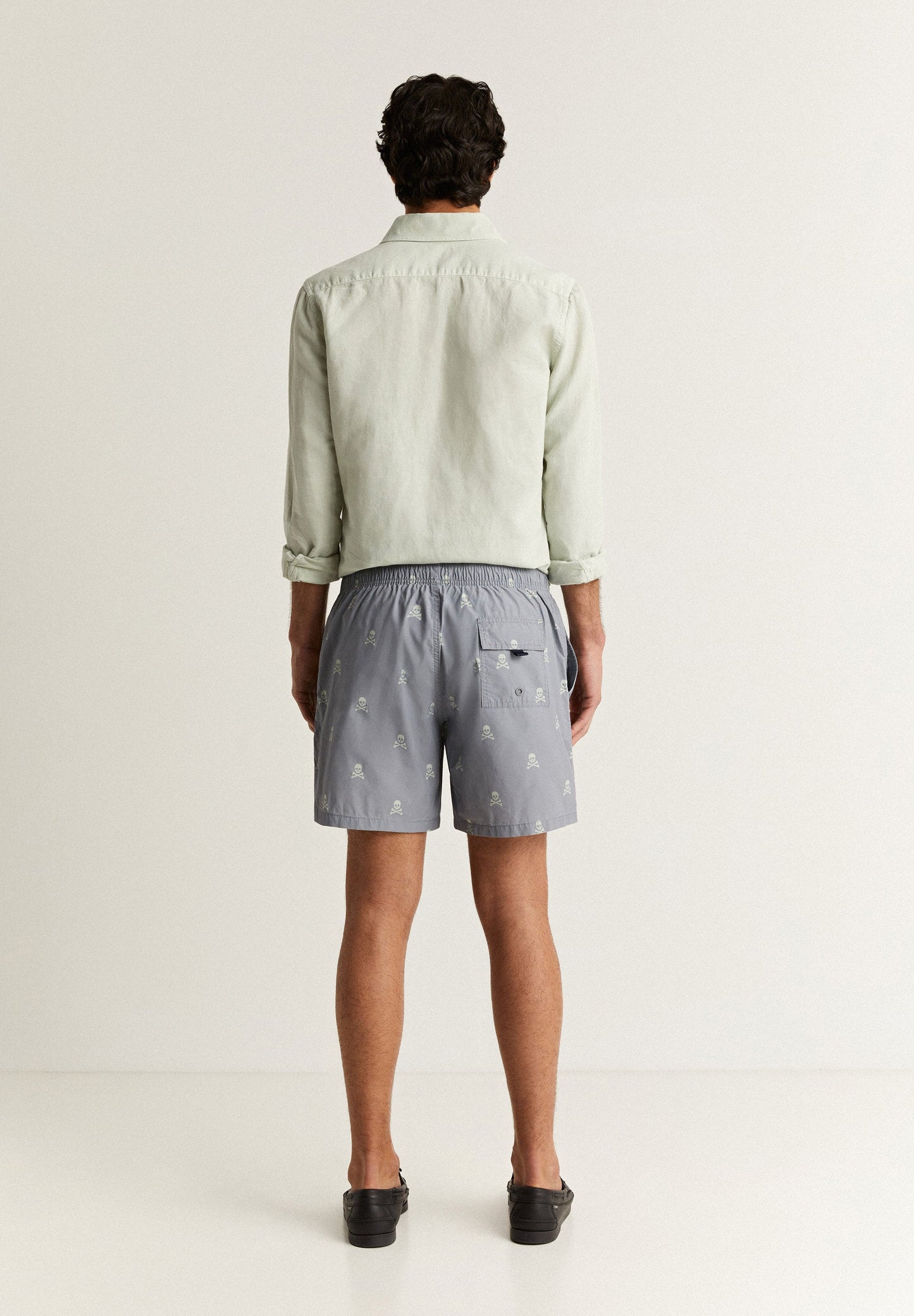 SWIMMING TRUNKS WITH ALL-OVER SKULLS