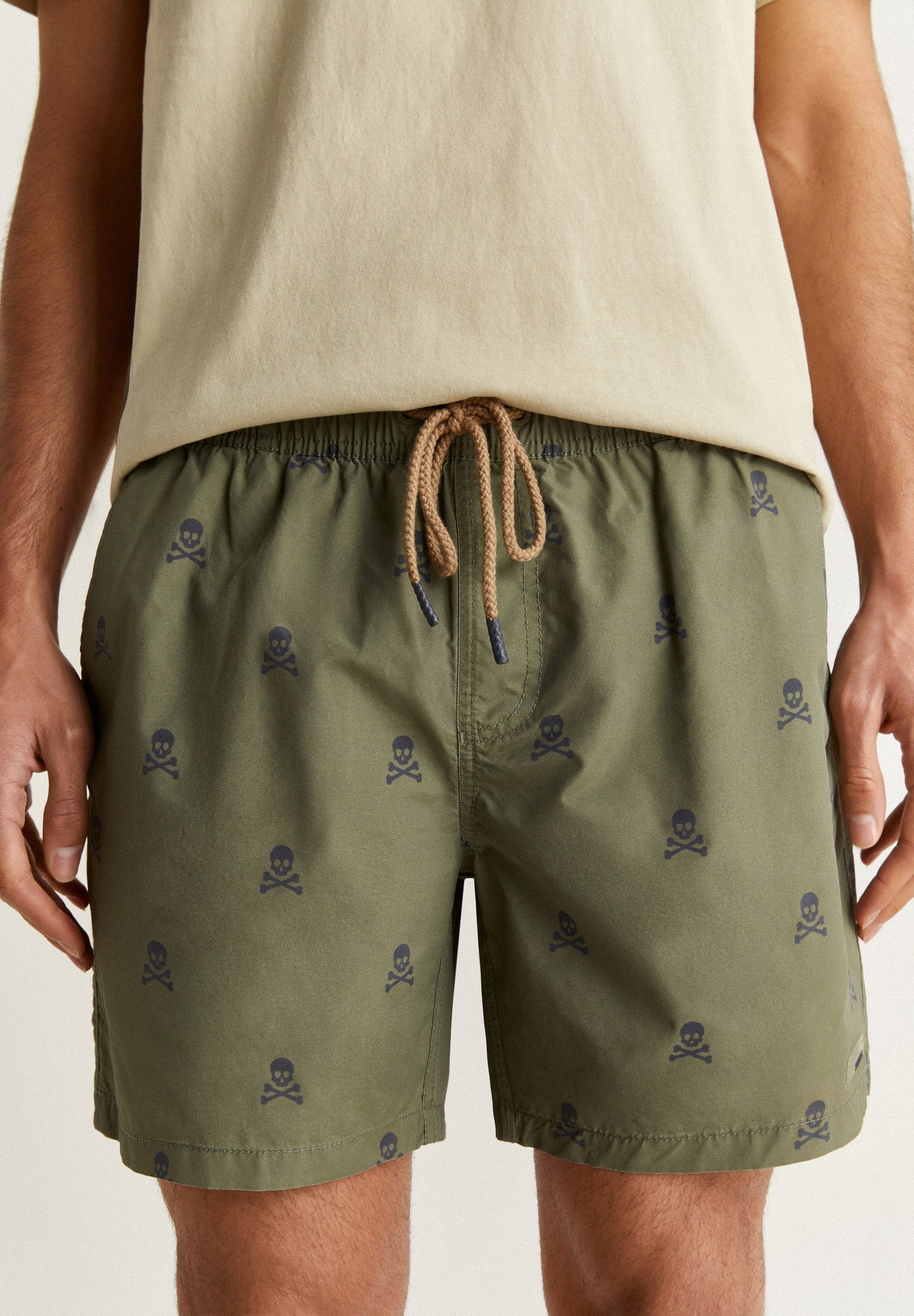 SWIMMING TRUNKS WITH ALL-OVER SKULLS