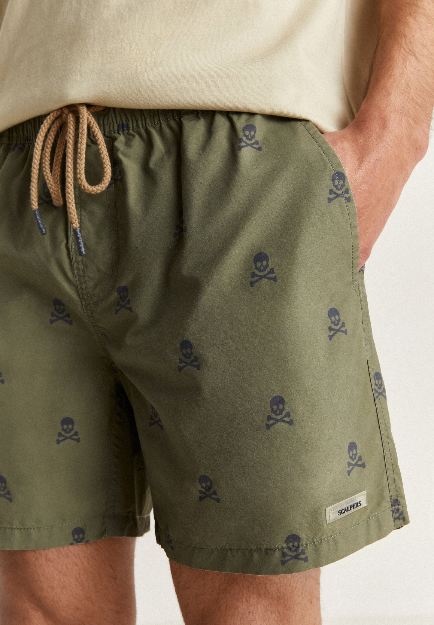 SWIMMING TRUNKS WITH ALL-OVER SKULLS