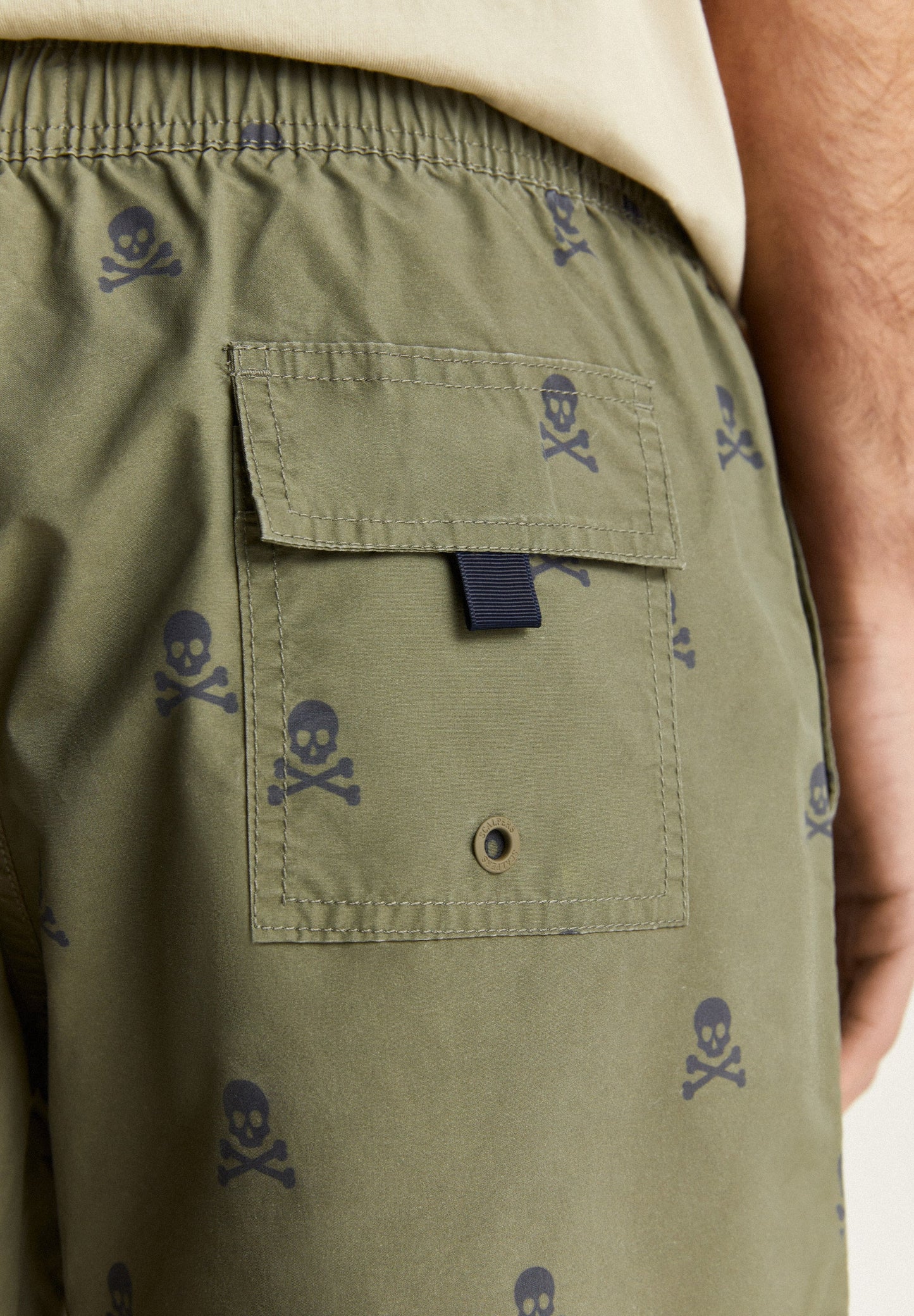 SWIMMING TRUNKS WITH ALL-OVER SKULLS