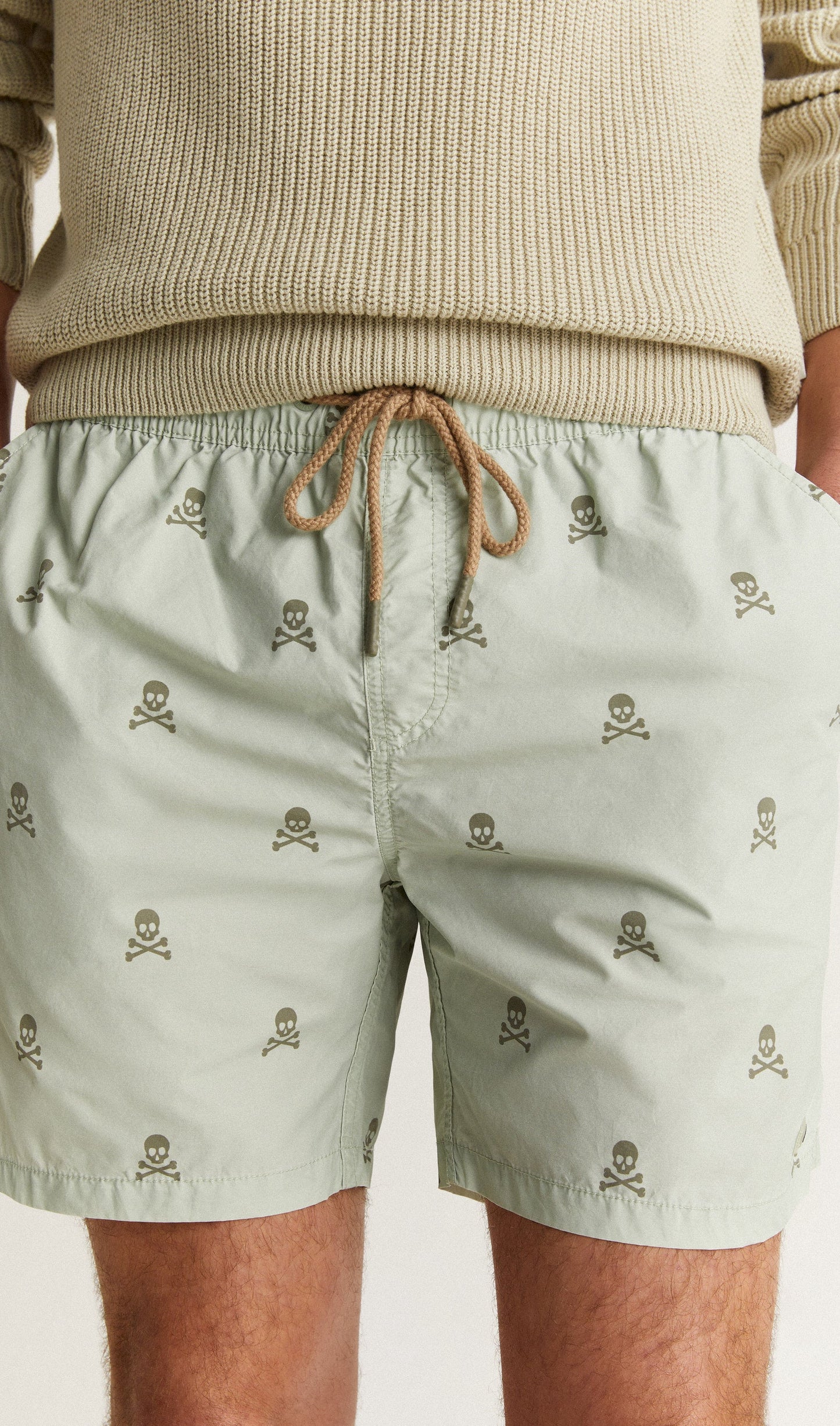 SWIMMING TRUNKS WITH ALL-OVER SKULLS