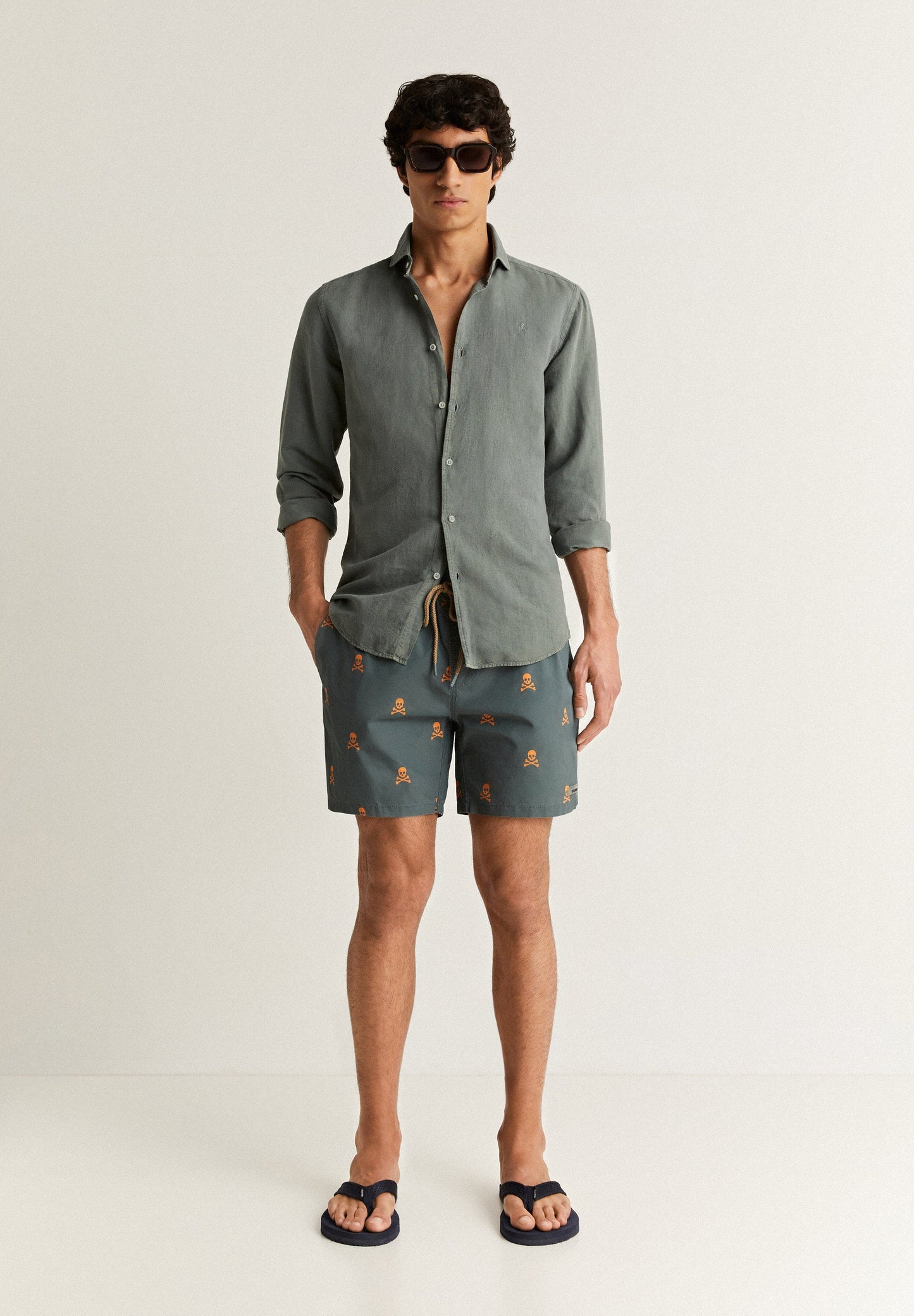 SWIMMING TRUNKS WITH ALL-OVER NEON SKULLS