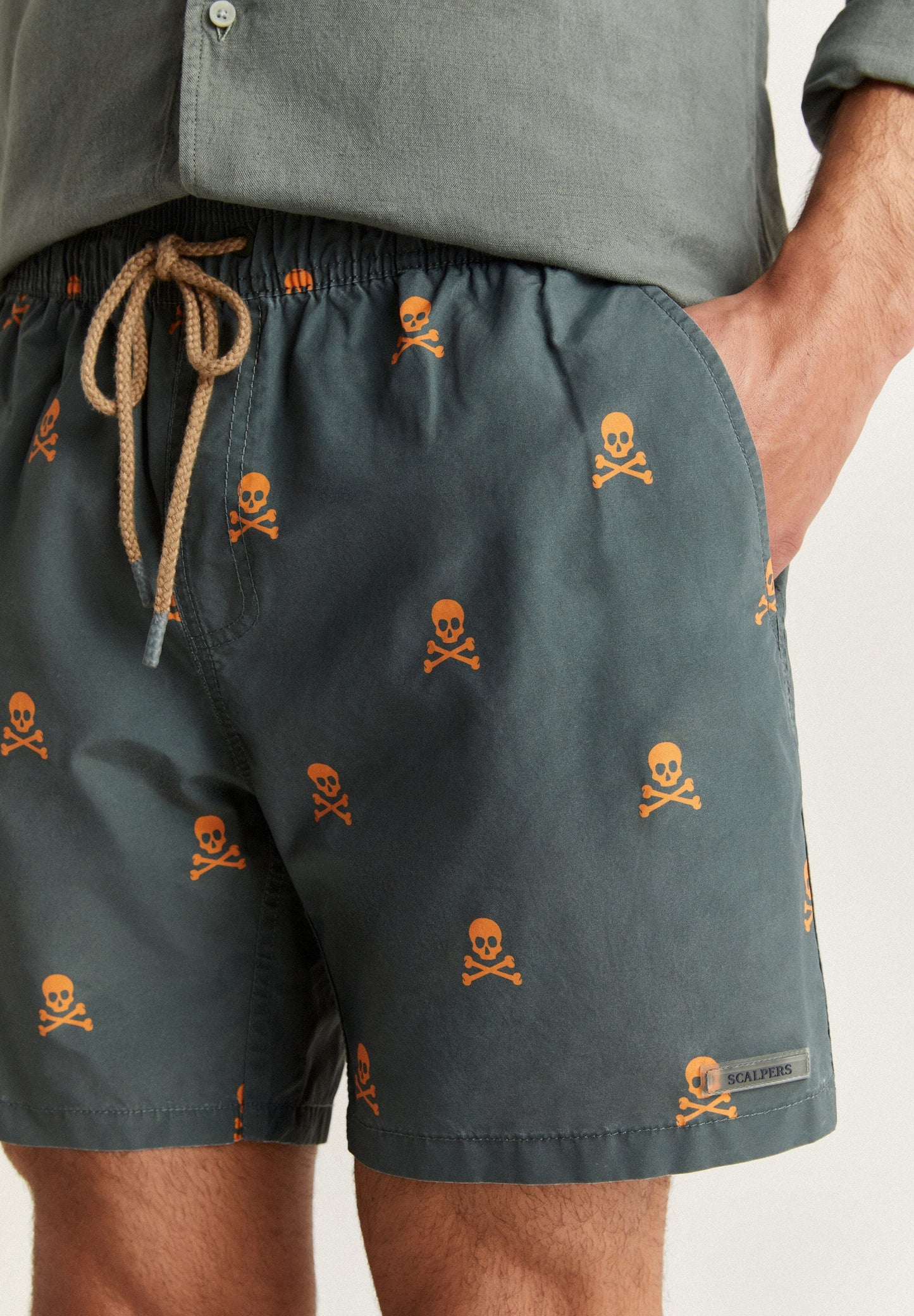 SWIMMING TRUNKS WITH ALL-OVER NEON SKULLS
