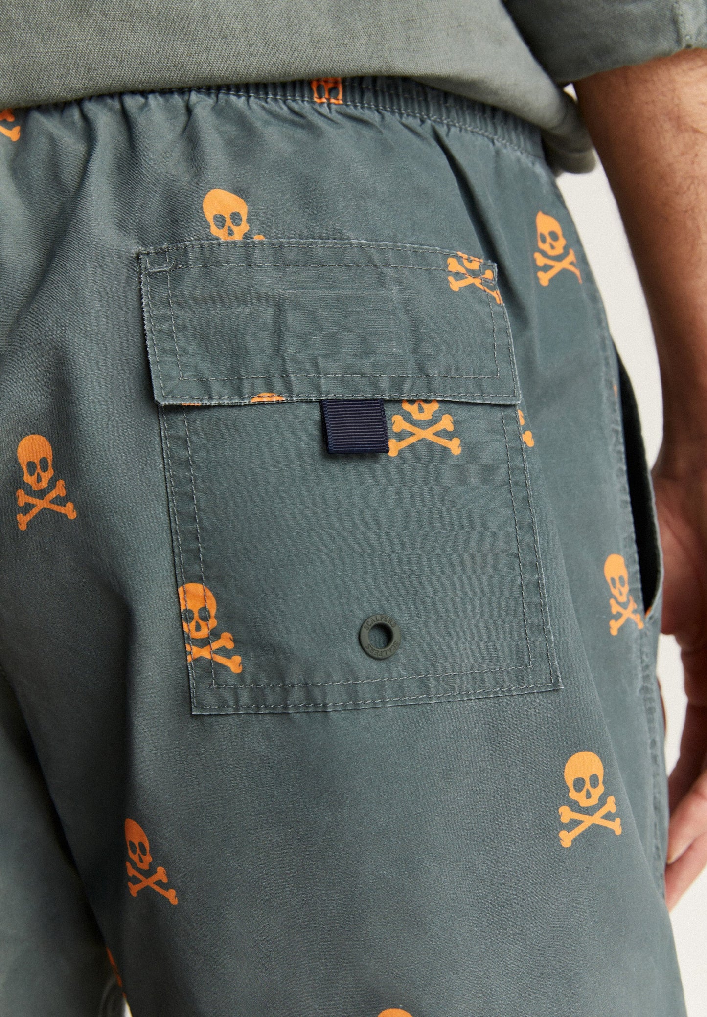 SWIMMING TRUNKS WITH ALL-OVER NEON SKULLS