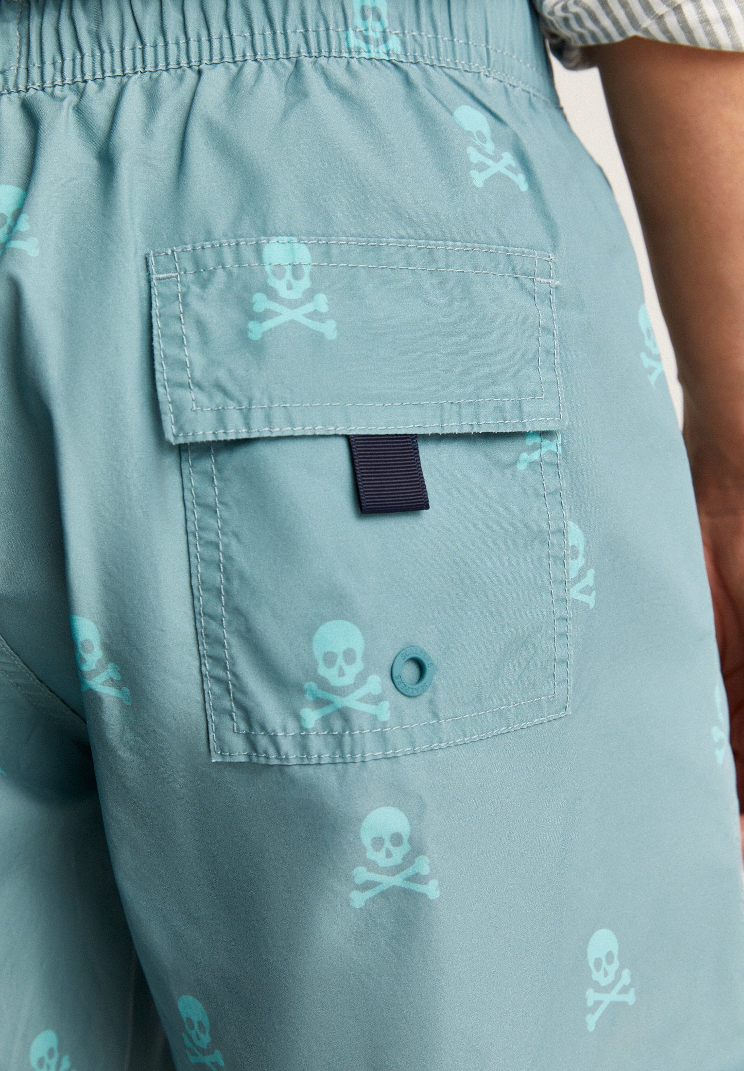 SWIMMING TRUNKS WITH ALL-OVER NEON SKULLS