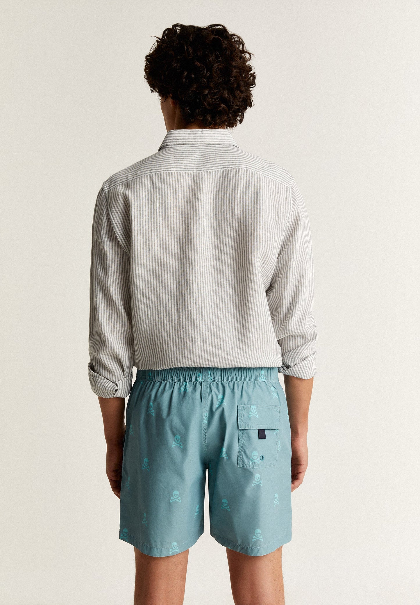 SWIMMING TRUNKS WITH ALL-OVER NEON SKULLS