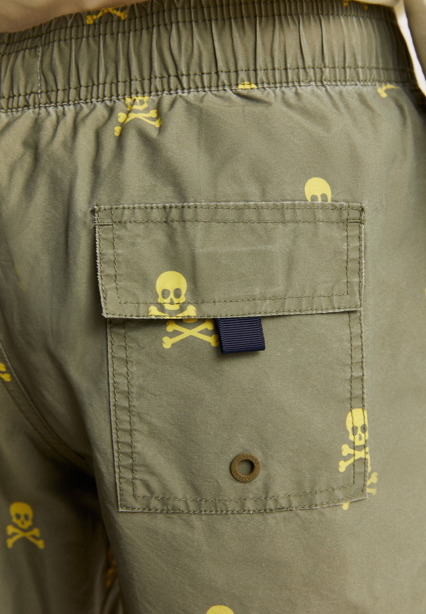 SWIMMING TRUNKS WITH ALL-OVER NEON SKULLS