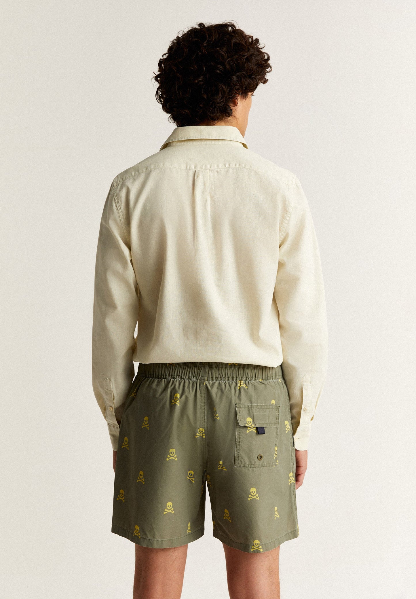 SWIMMING TRUNKS WITH ALL-OVER NEON SKULLS