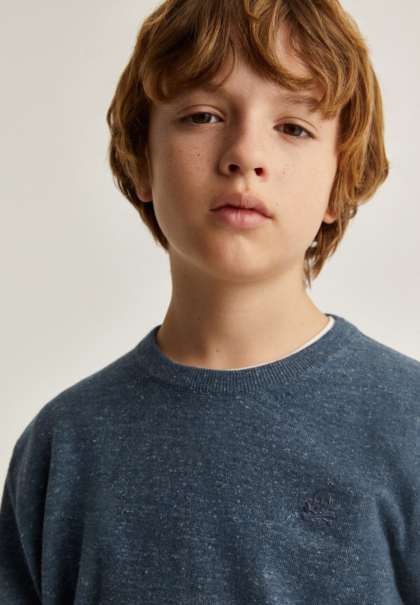 SPECKLED SWEATER WITH SKULL