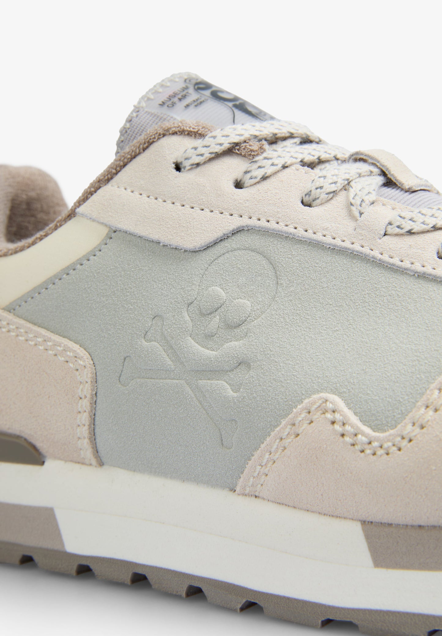 RAISED SKULL SNEAKERS