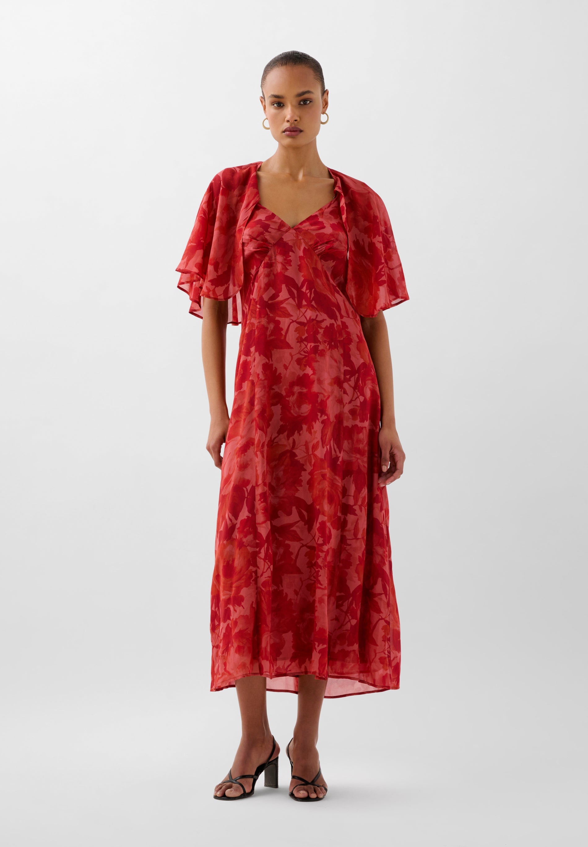 FLOWING PRINTED DRESS WITH CAPE
