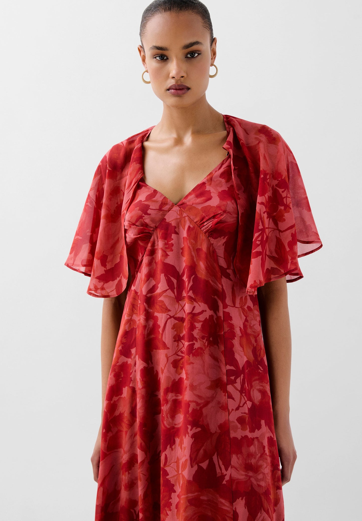 FLOWING PRINTED DRESS WITH CAPE