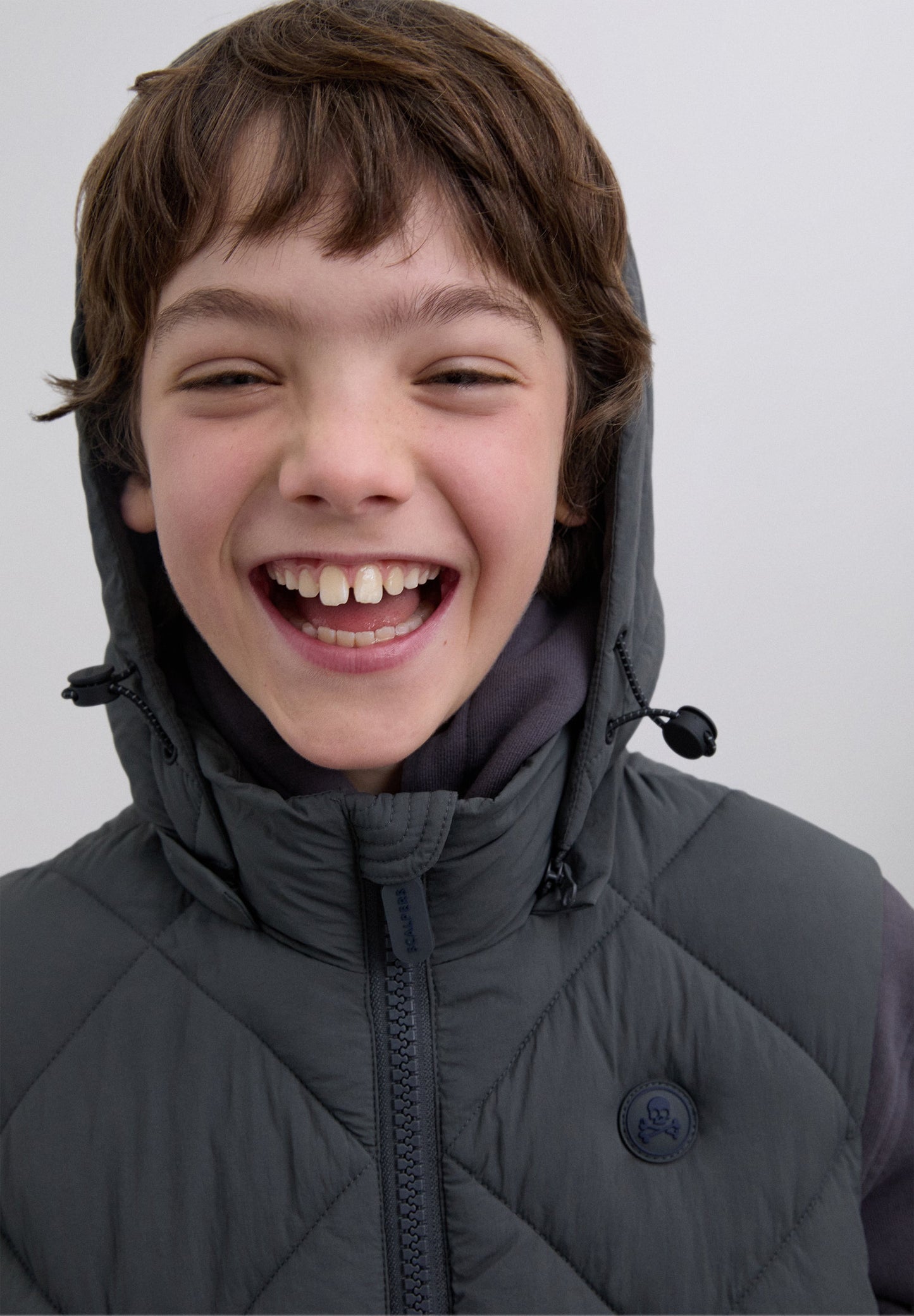 DOUDOUNE SANS MANCHES CAPUCHE SKULL