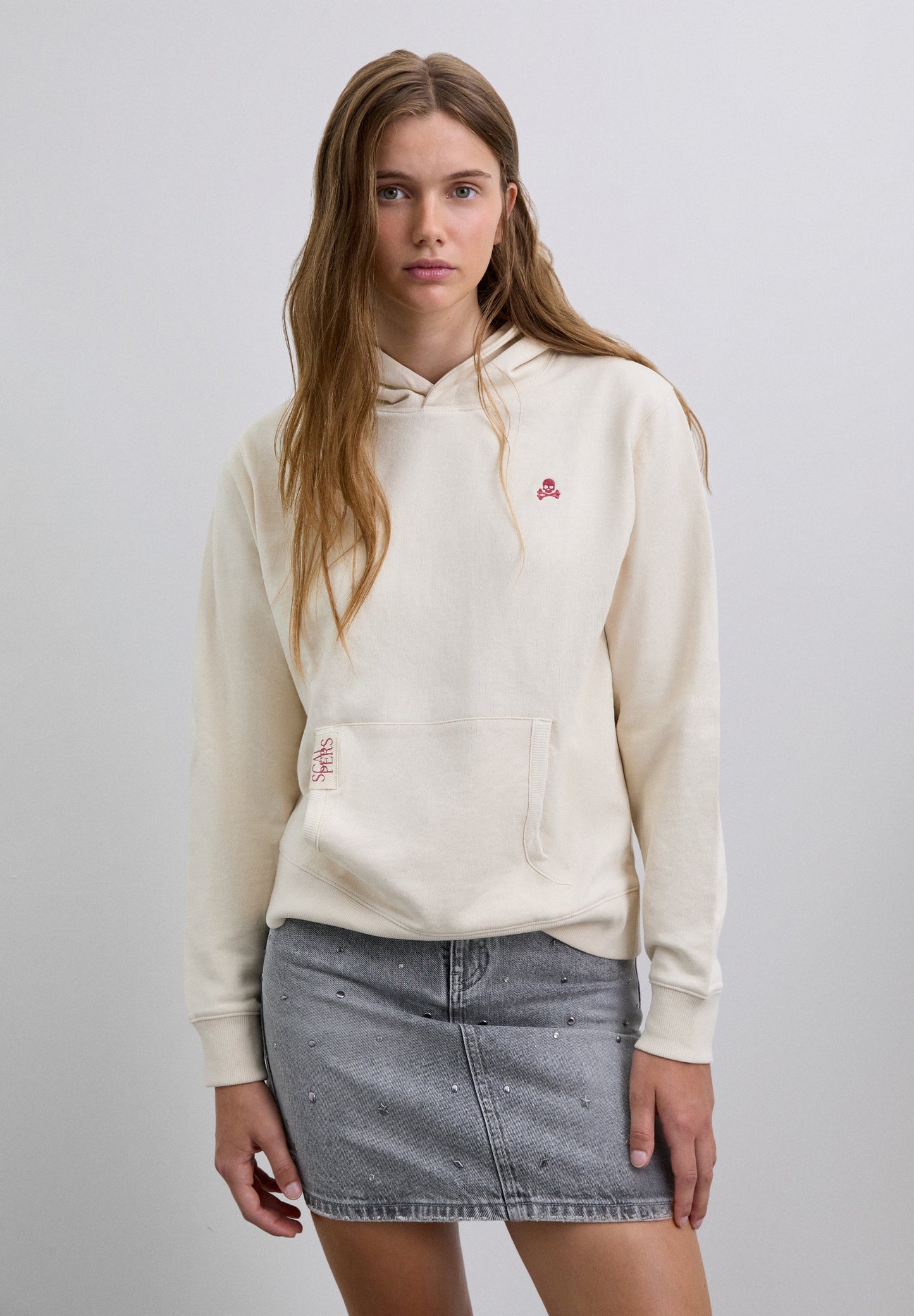 FALDA MINI DENIM TACHUELAS