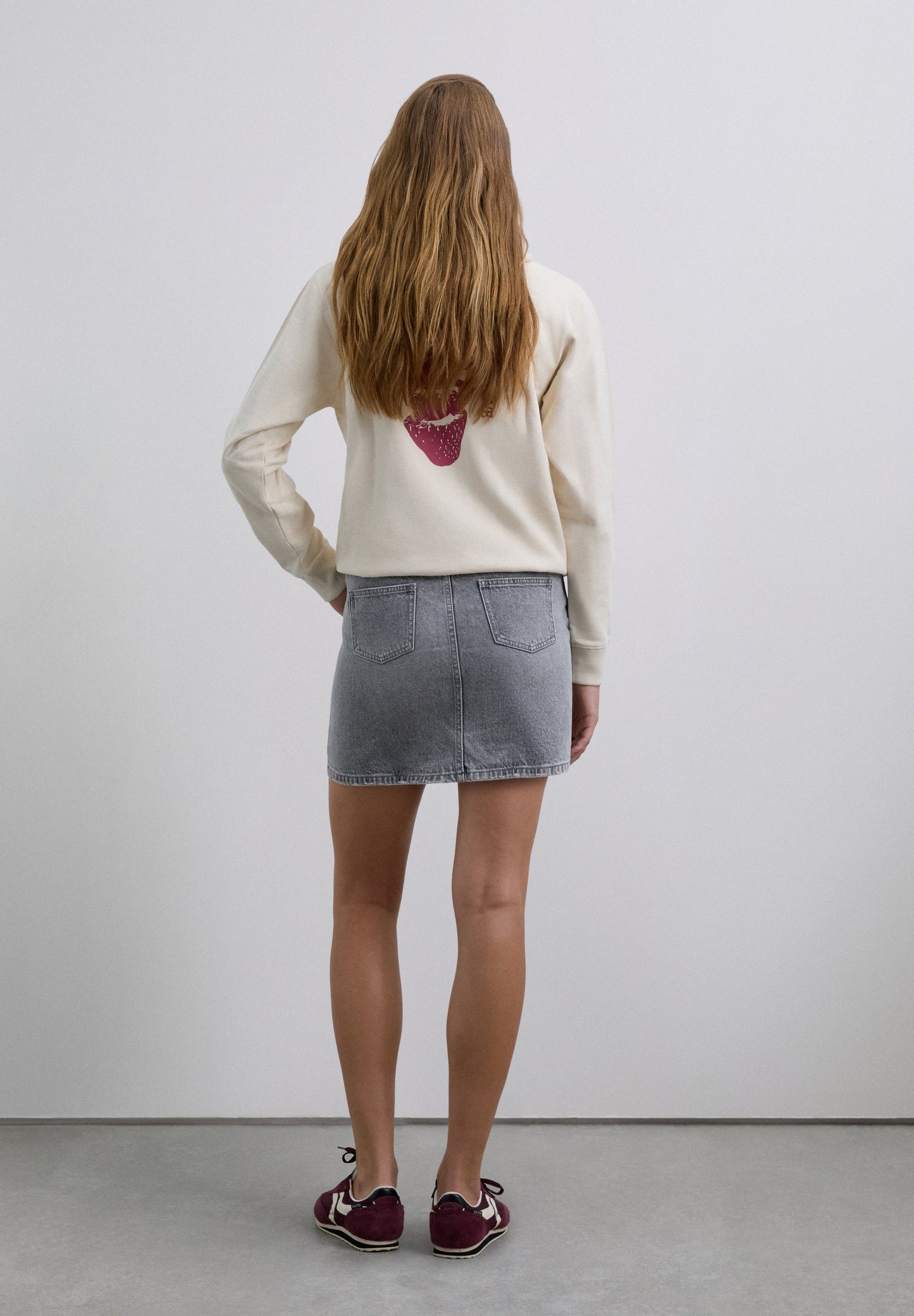 FALDA MINI DENIM TACHUELAS