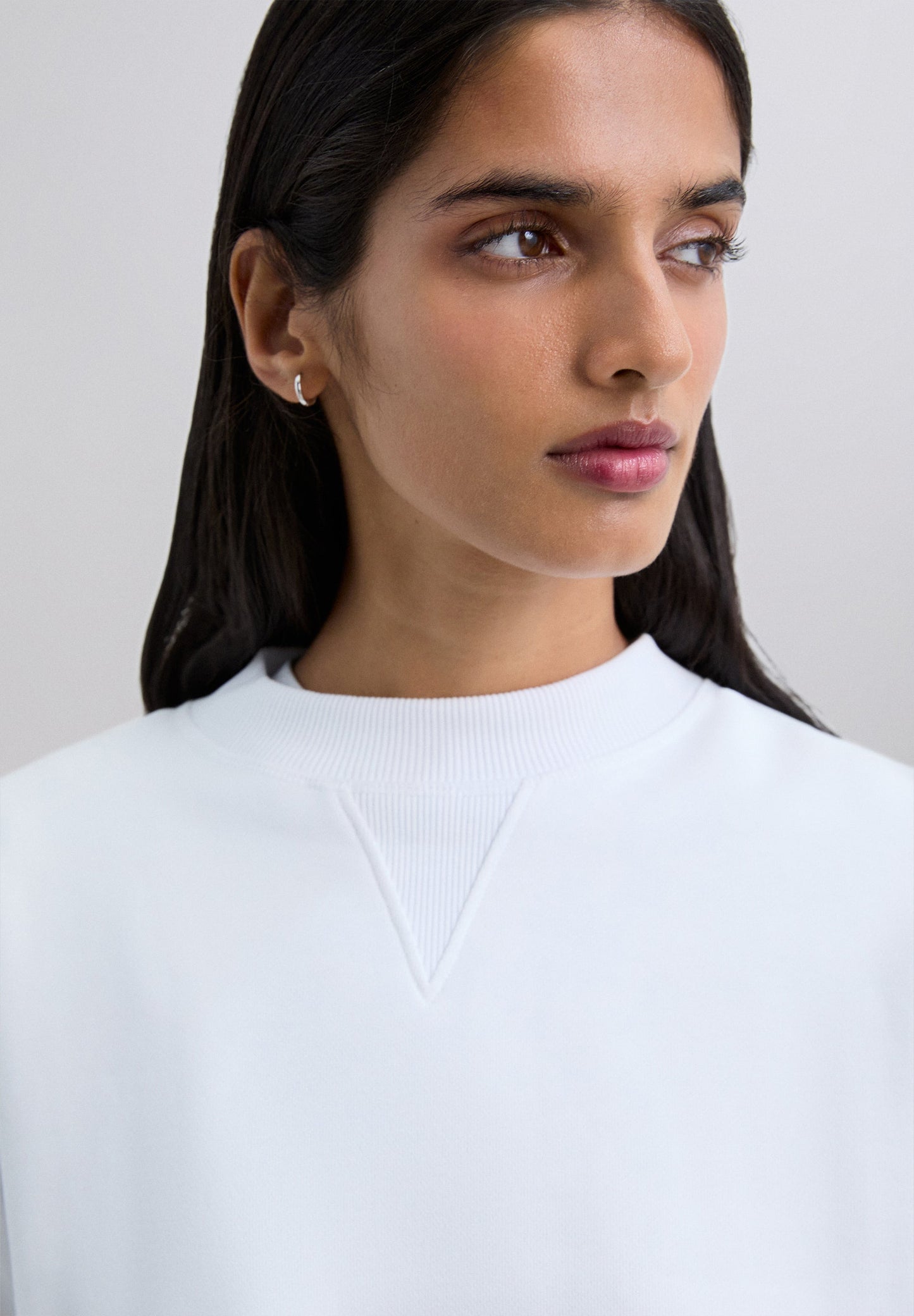 SWEATER DOODSHOOFD ACHTER GLITTER