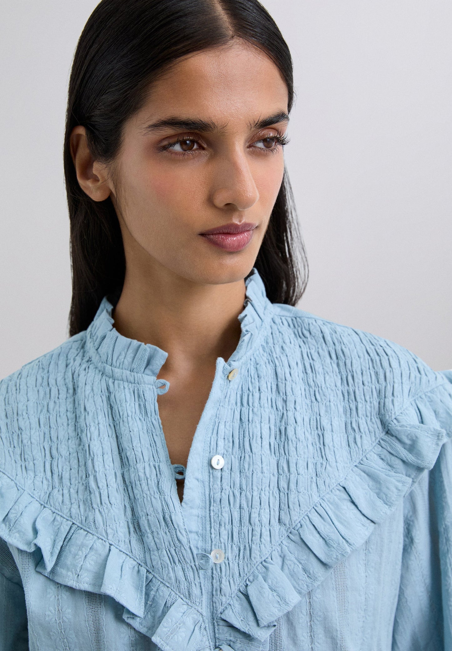 RUCHED BLOUSE WITH RUFFLES.