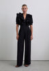 SCHWARZER JUMPSUIT MIT VOLANTS