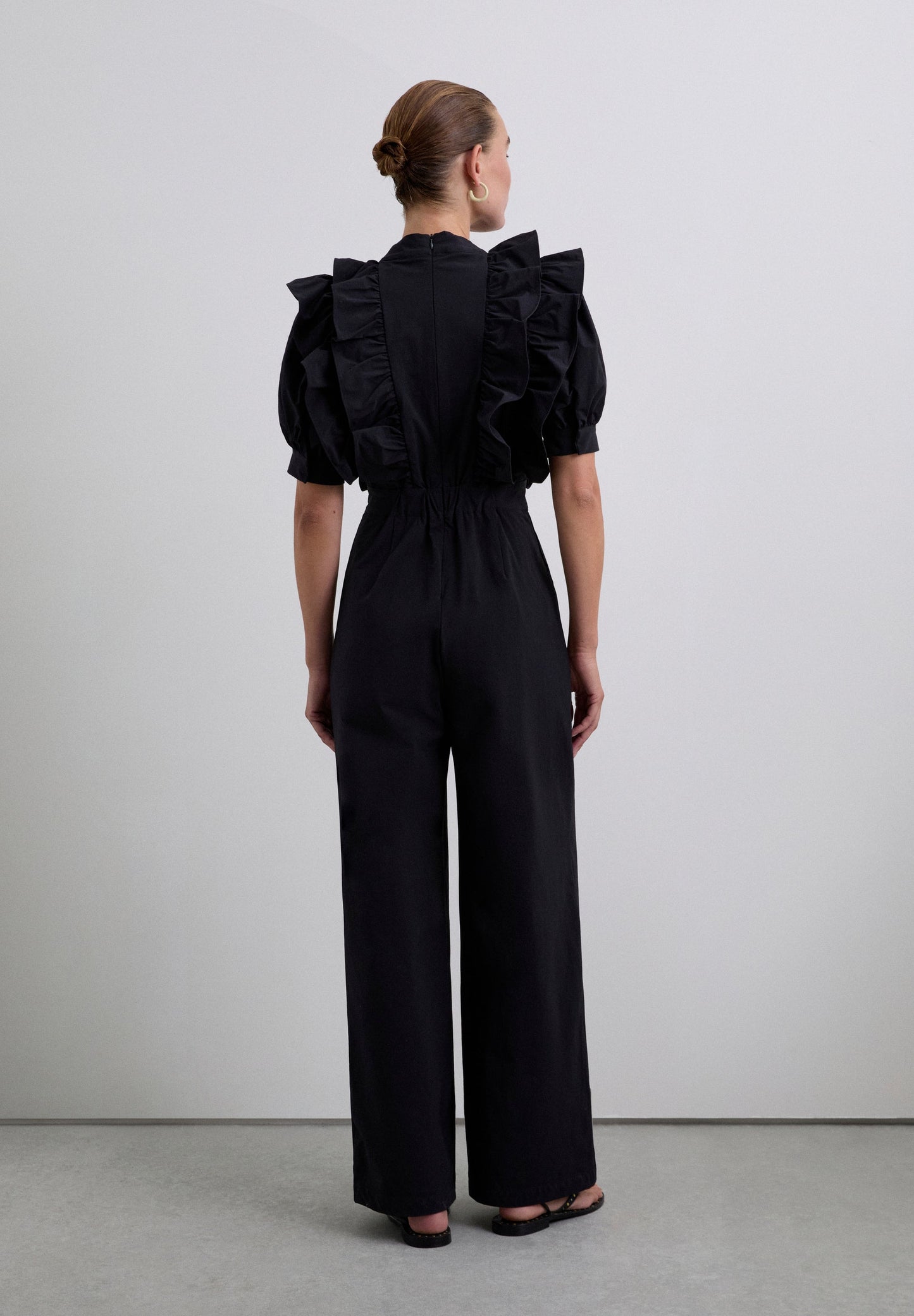 JUMPSUIT ZWART VOLANTS