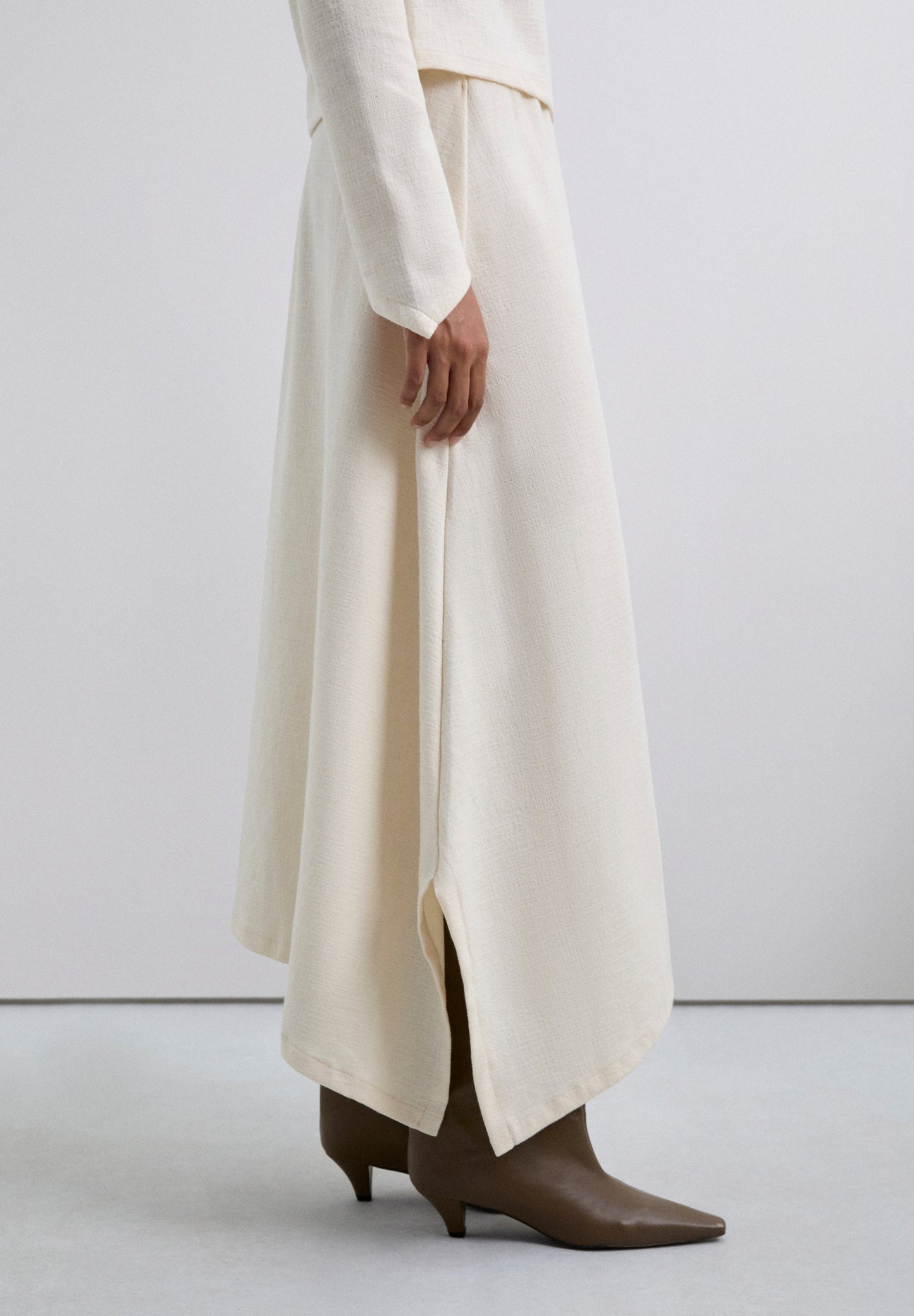 HALFLANGE ROK TRICOT ASYMMETRISCH