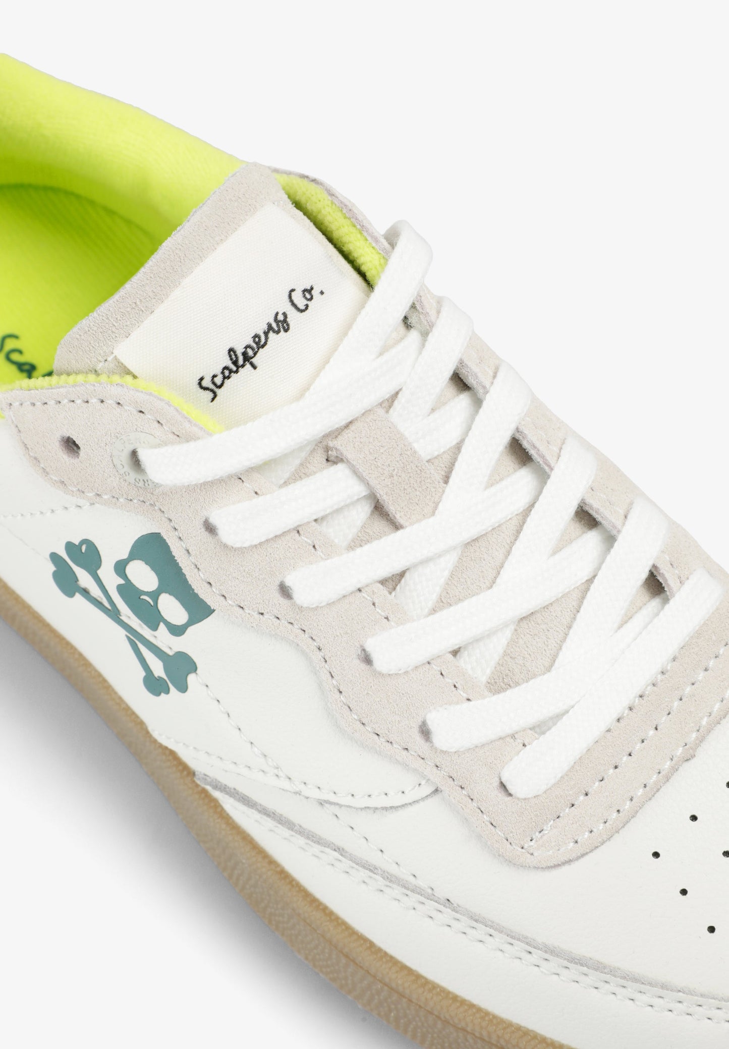 SNEAKERS WITH NEON SKULL DETAIL
