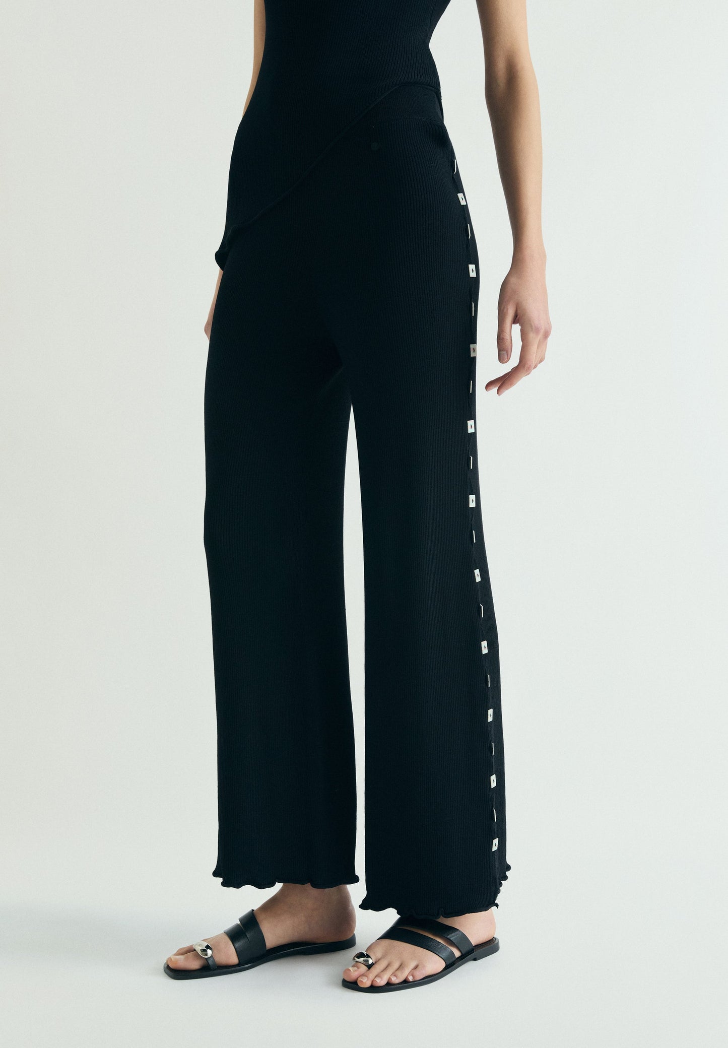 KNIT TROUSERS WITH SIDE APPLIQUÉS