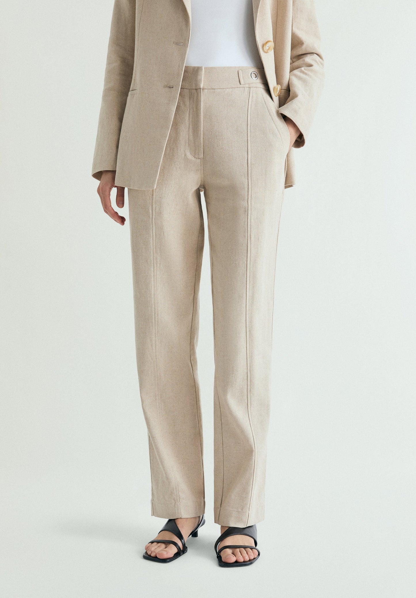 LINEN TROUSERS WITH METAL DETAILS