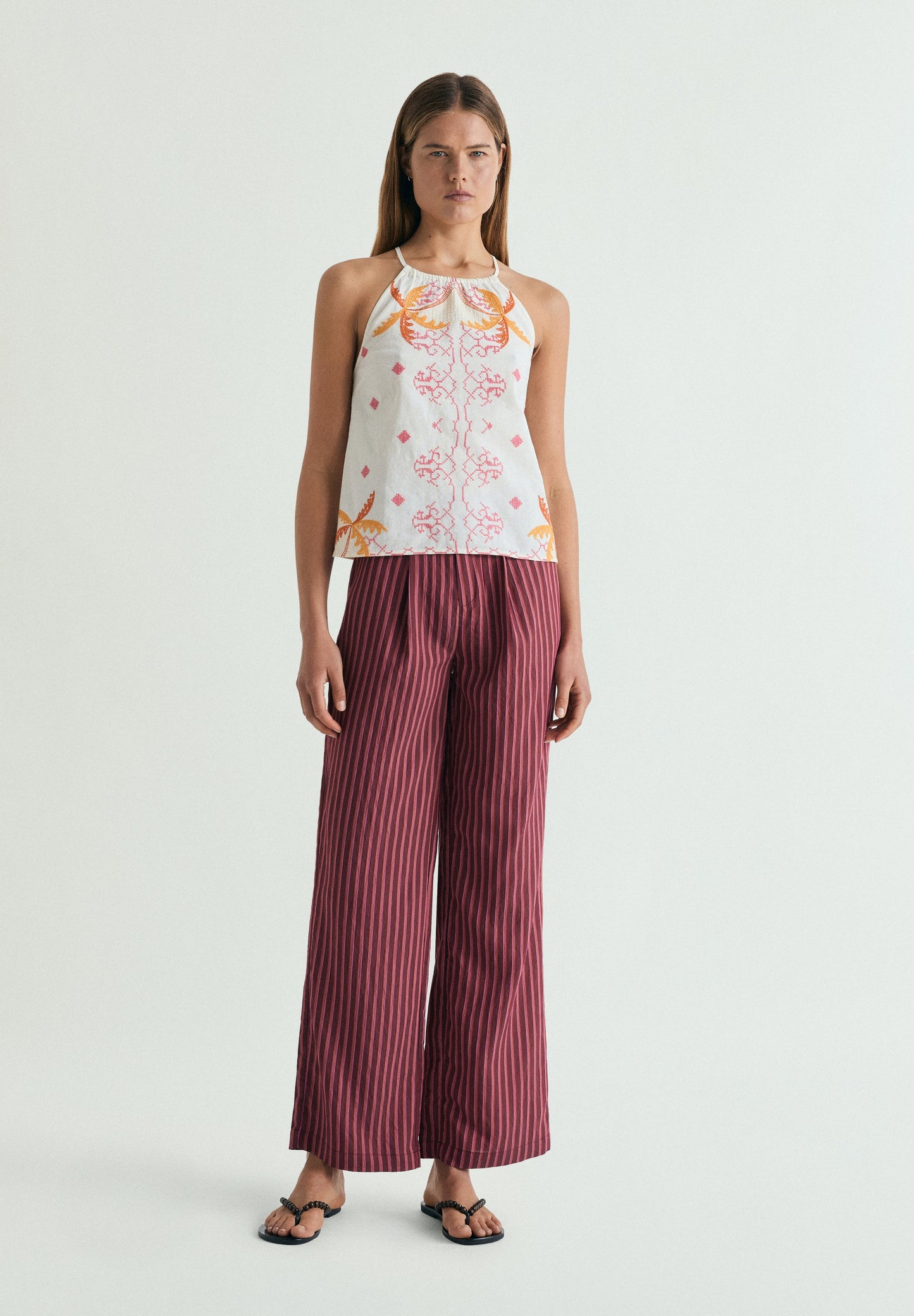 RUFFLED HALTER TOP WITH EMBROIDERY