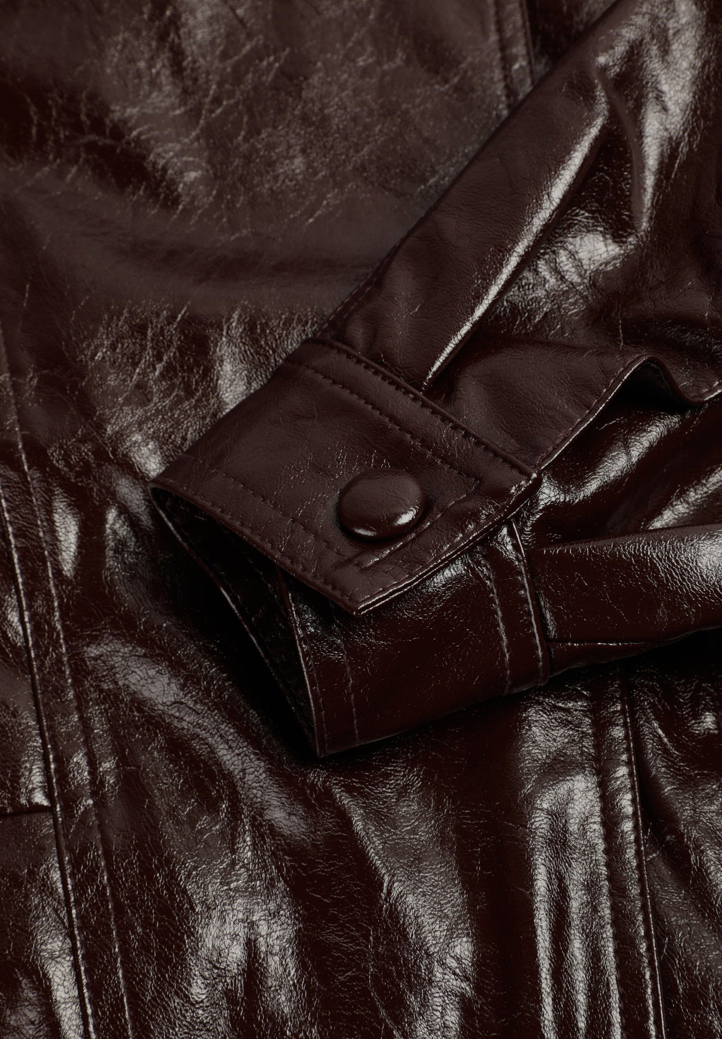 HIGH-NECKED JACKET WITH A PATENT-LEATHER FINISH